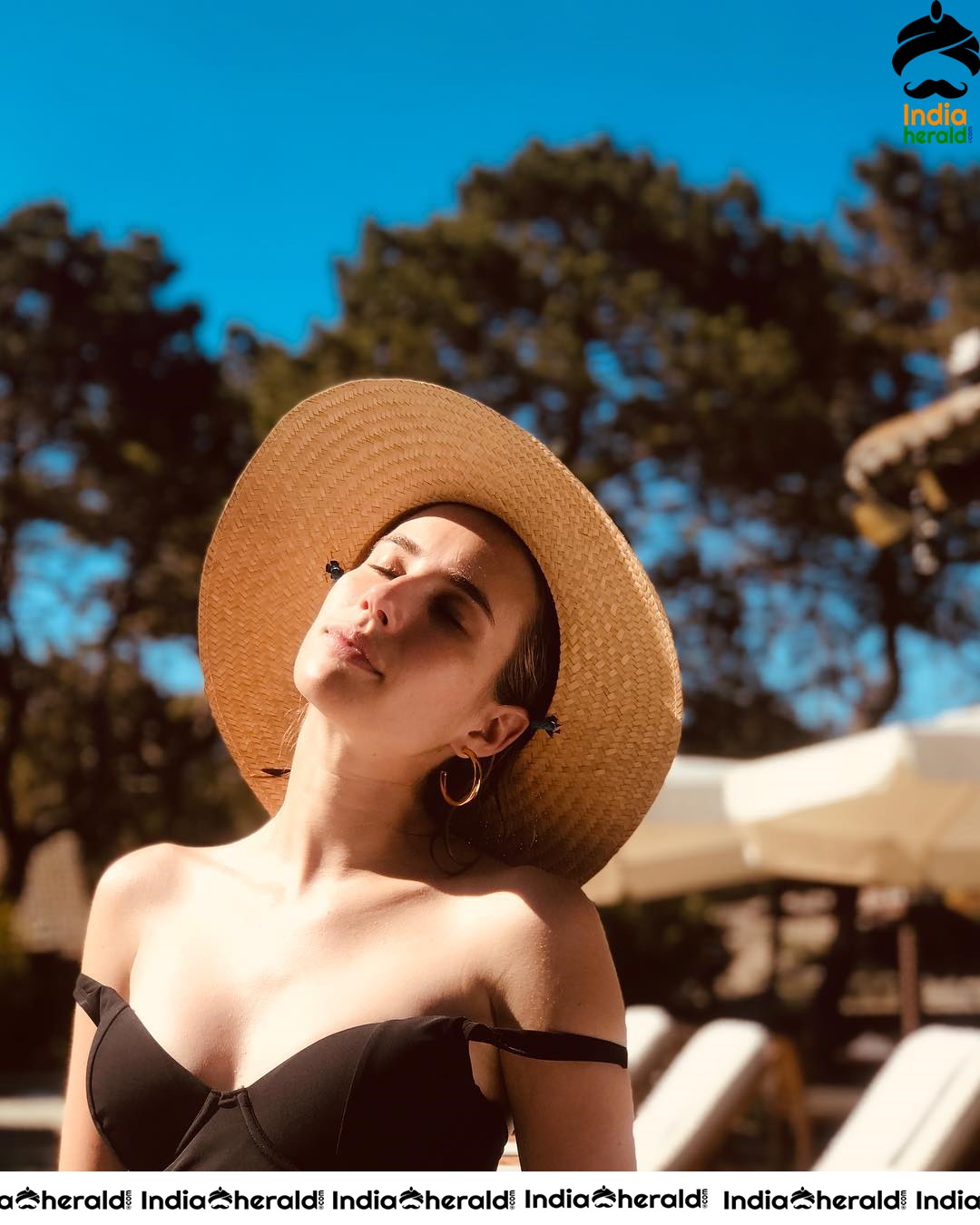 Emma Roberts Chilling in a Black Bikini Top