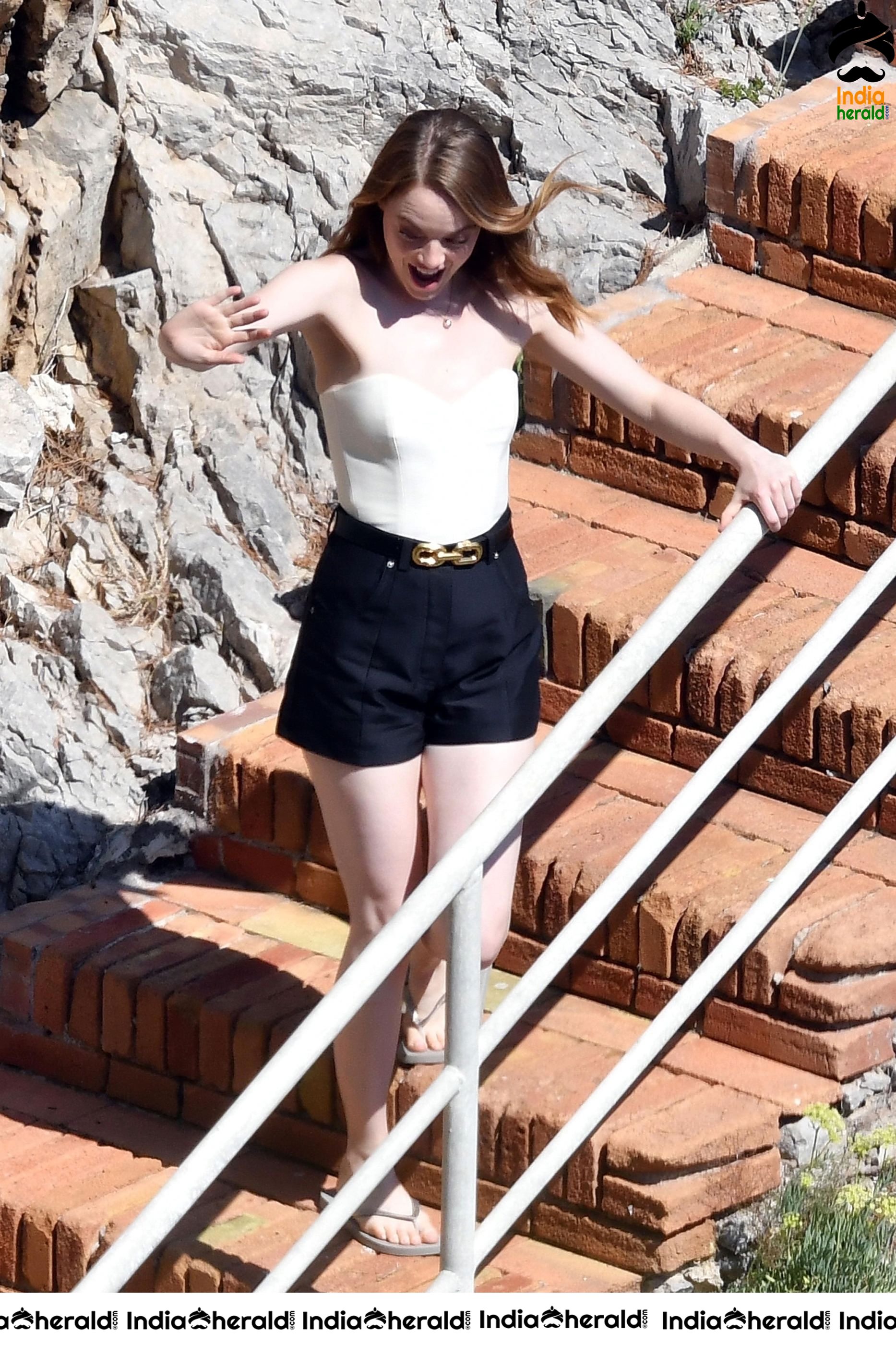 Emma Stone in Single Piece Bikini shooting an advertisement for Louis Vuitton Set 1
