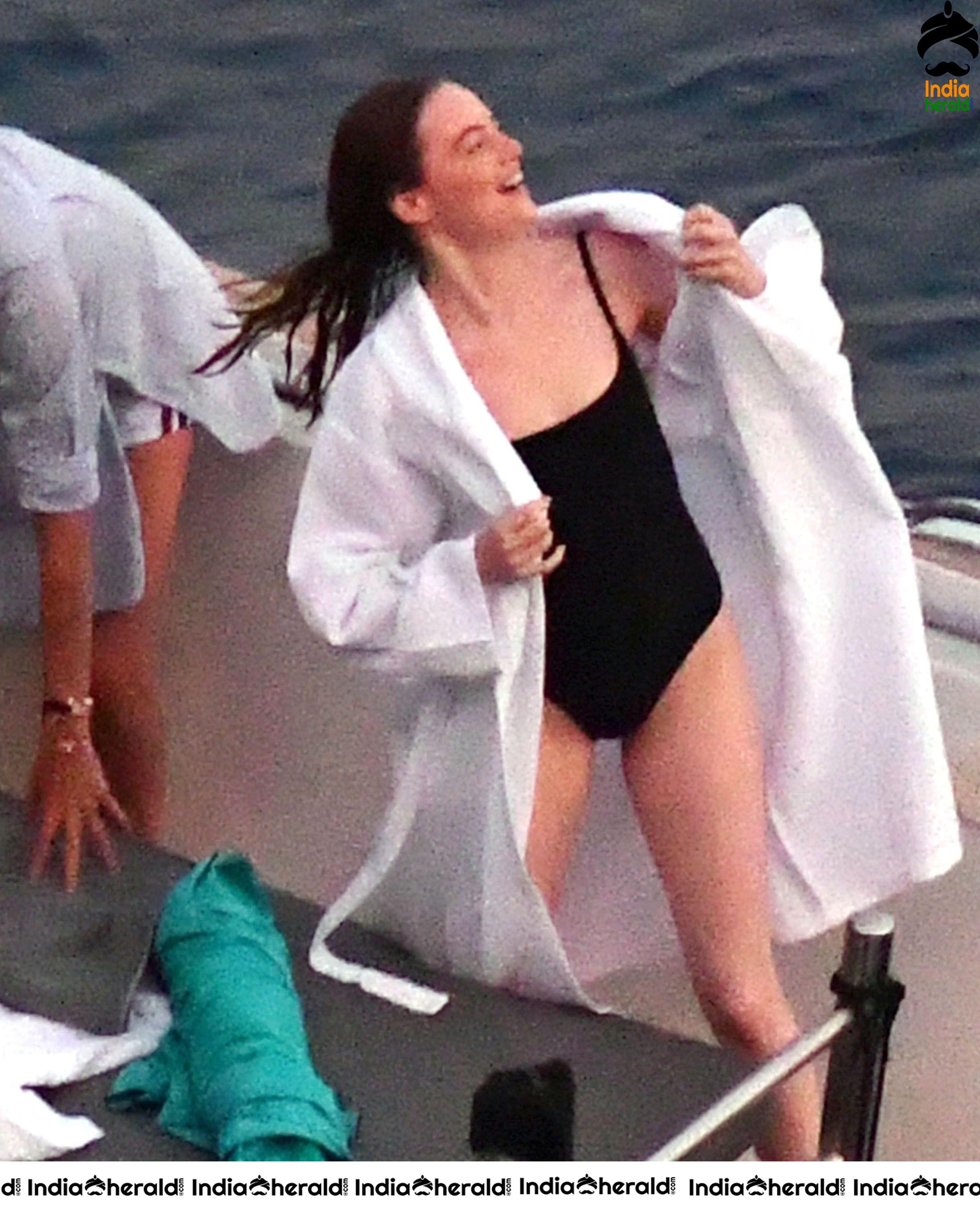 Emma Stone in Single Piece Bikini shooting an advertisement for Louis Vuitton Set 1