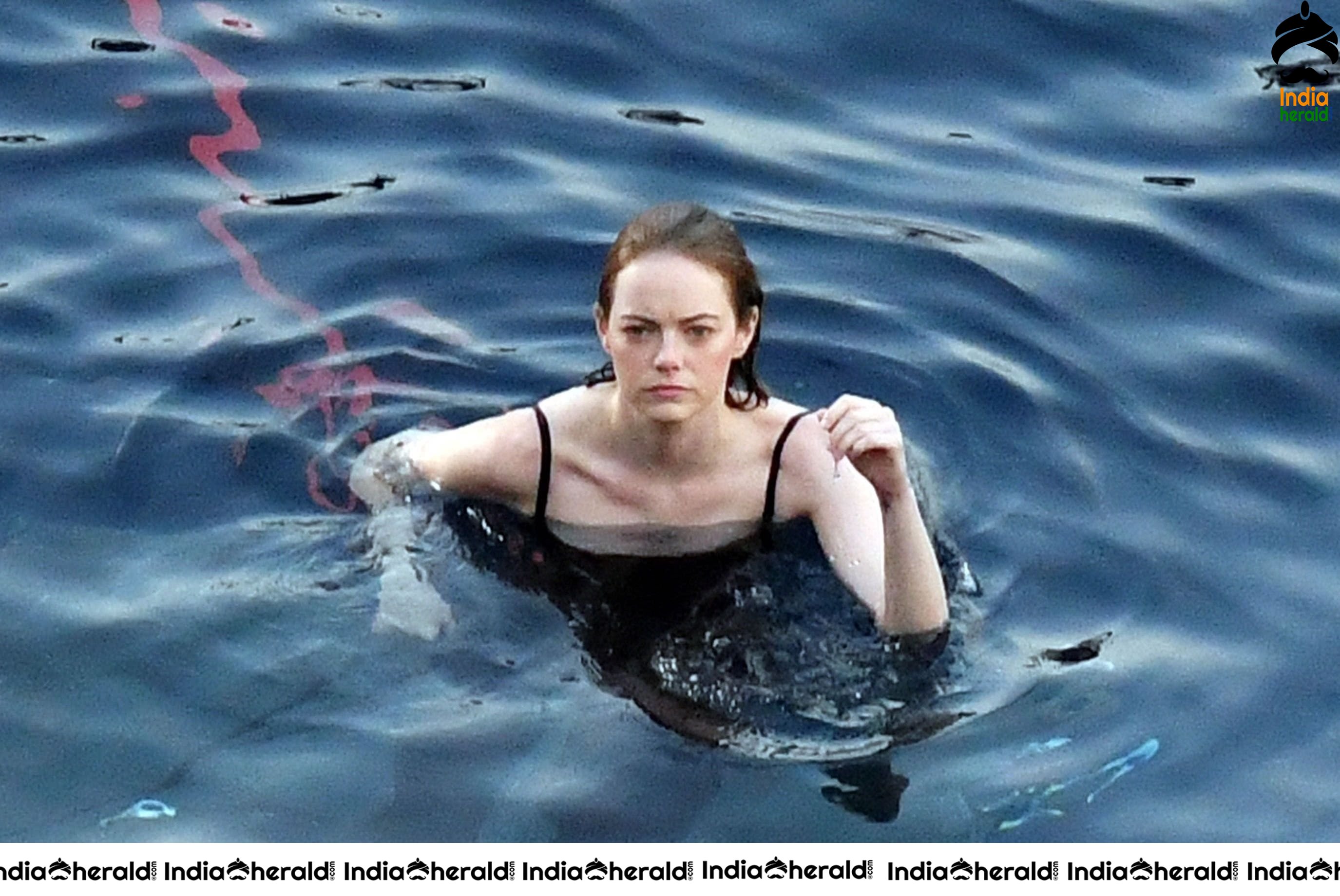 Emma Stone in Single Piece Bikini shooting an advertisement for Louis Vuitton Set 2