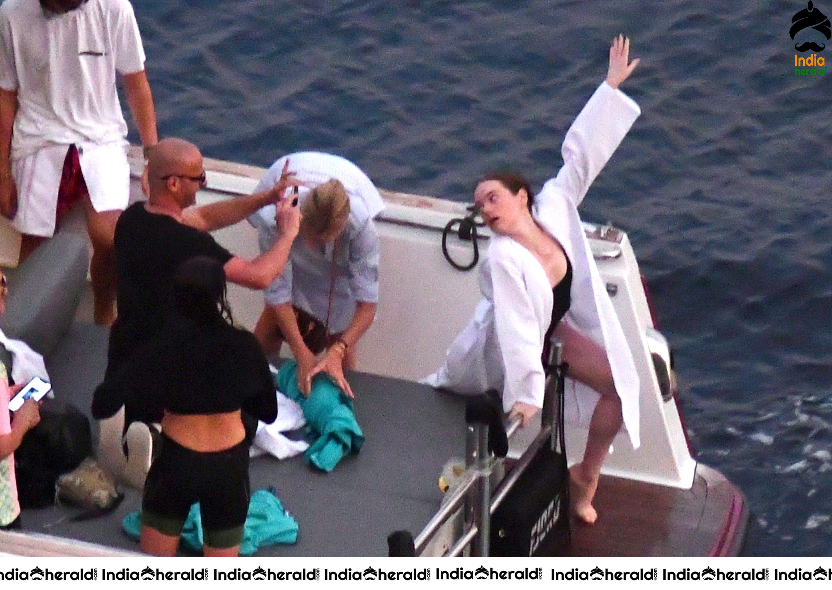 Emma Stone in Single Piece Bikini shooting an advertisement for Louis Vuitton Set 2