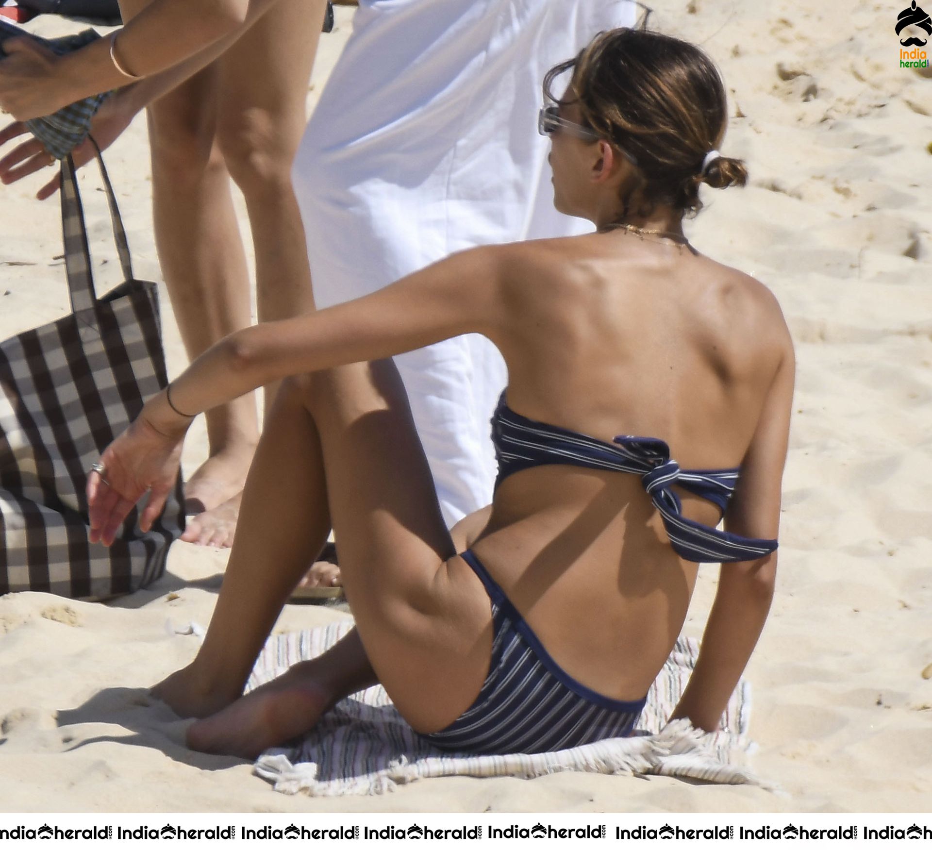 Georgia Fowler hits Bondi Beach in a navy striped bikini