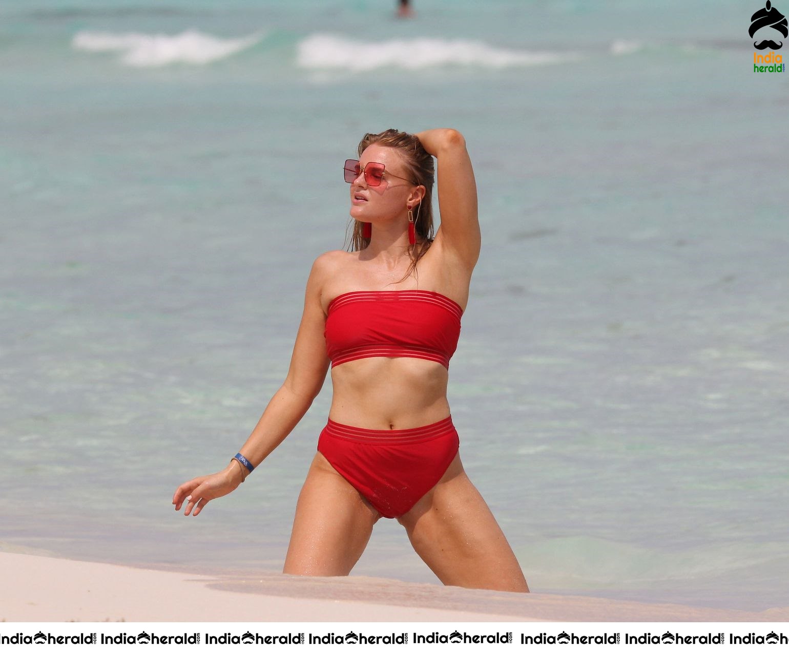Grace Levy in a two piece red bikini while in Tulum Mexico