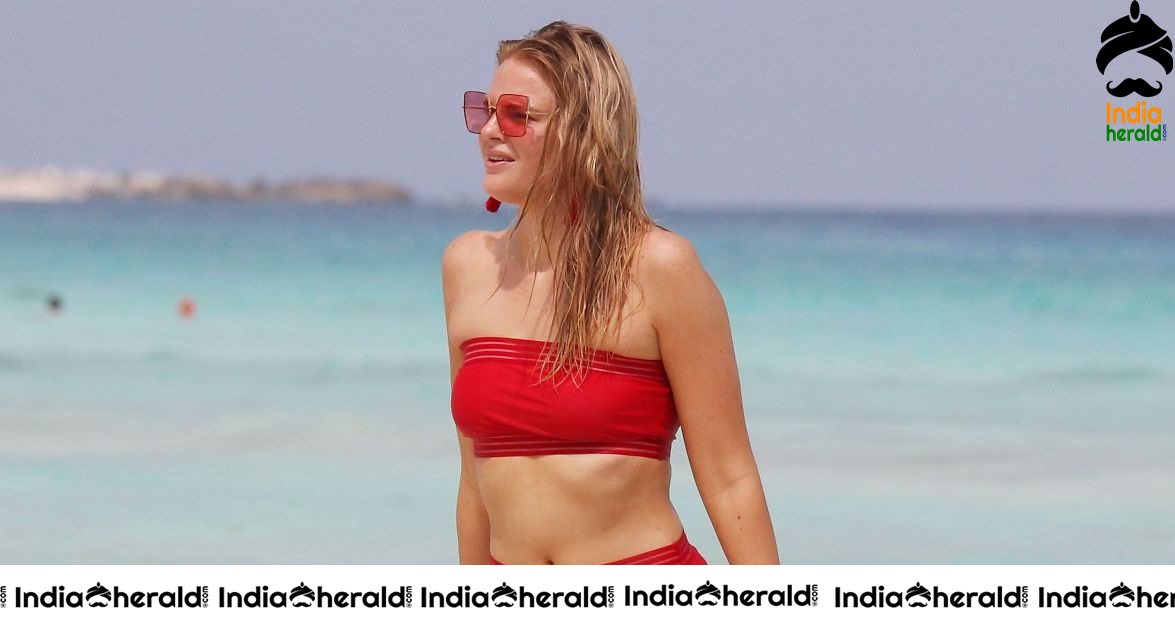 Grace Levy in a two piece red bikini while in Tulum Mexico