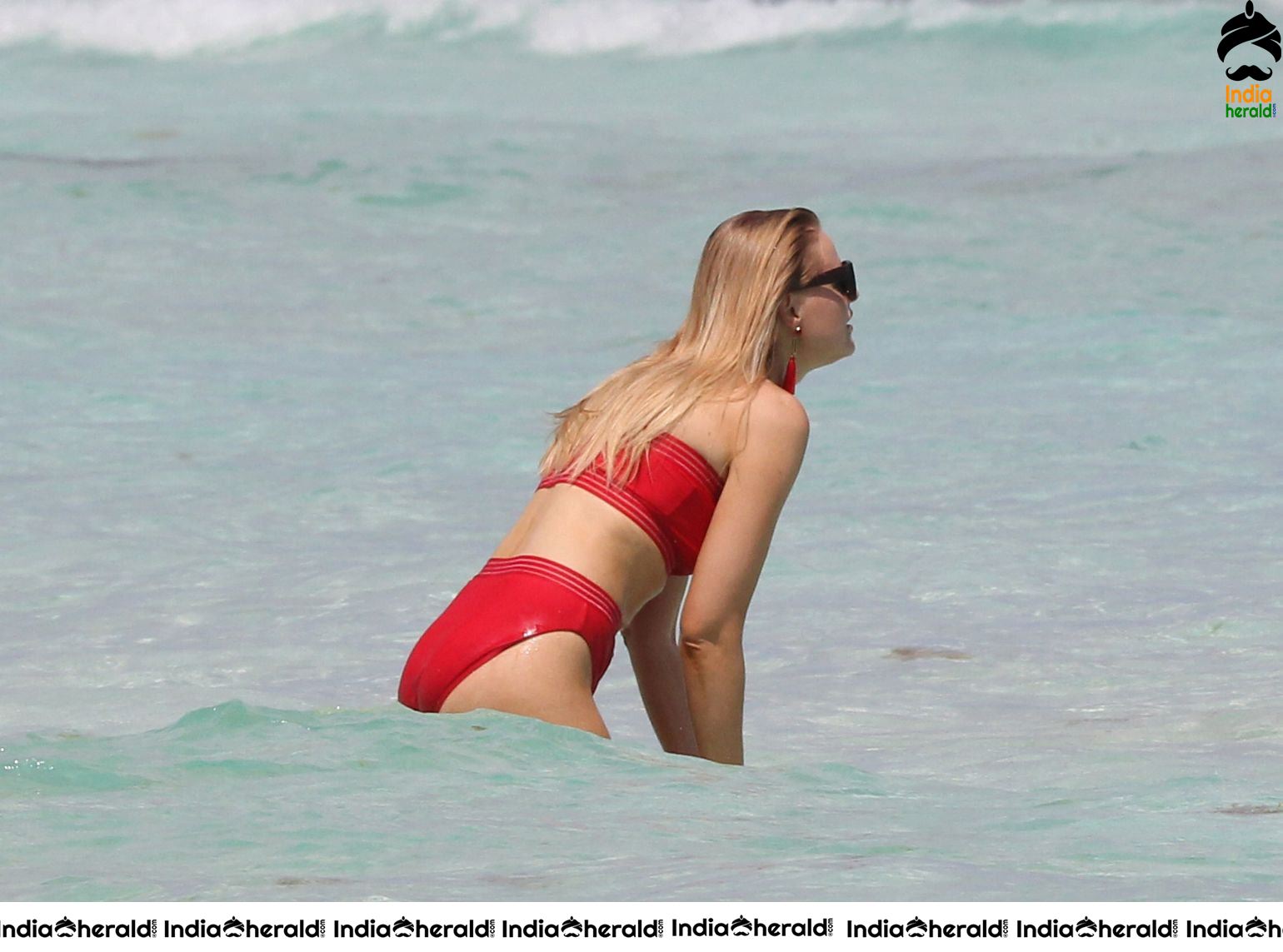 Grace Levy in a two piece red bikini while in Tulum Mexico