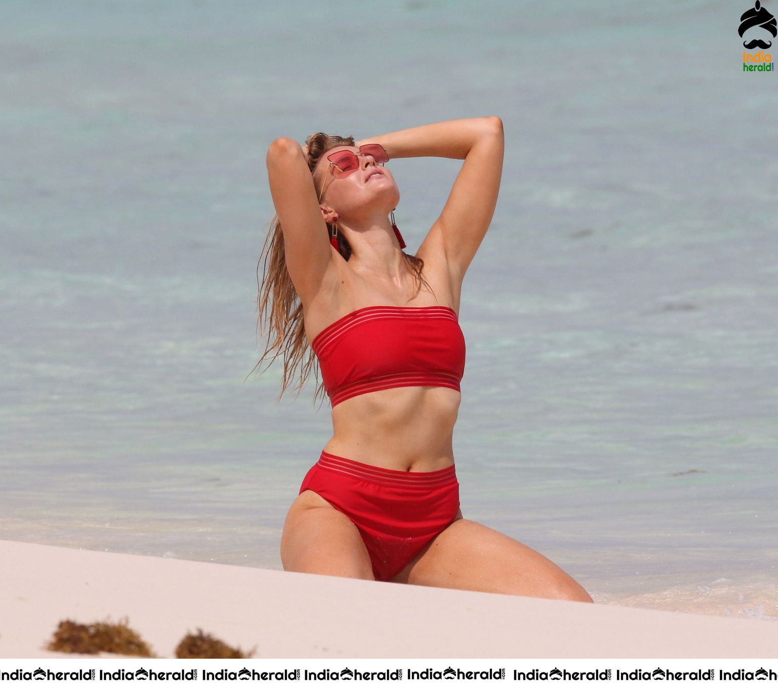 Grace Levy in a two piece red bikini while in Tulum Mexico