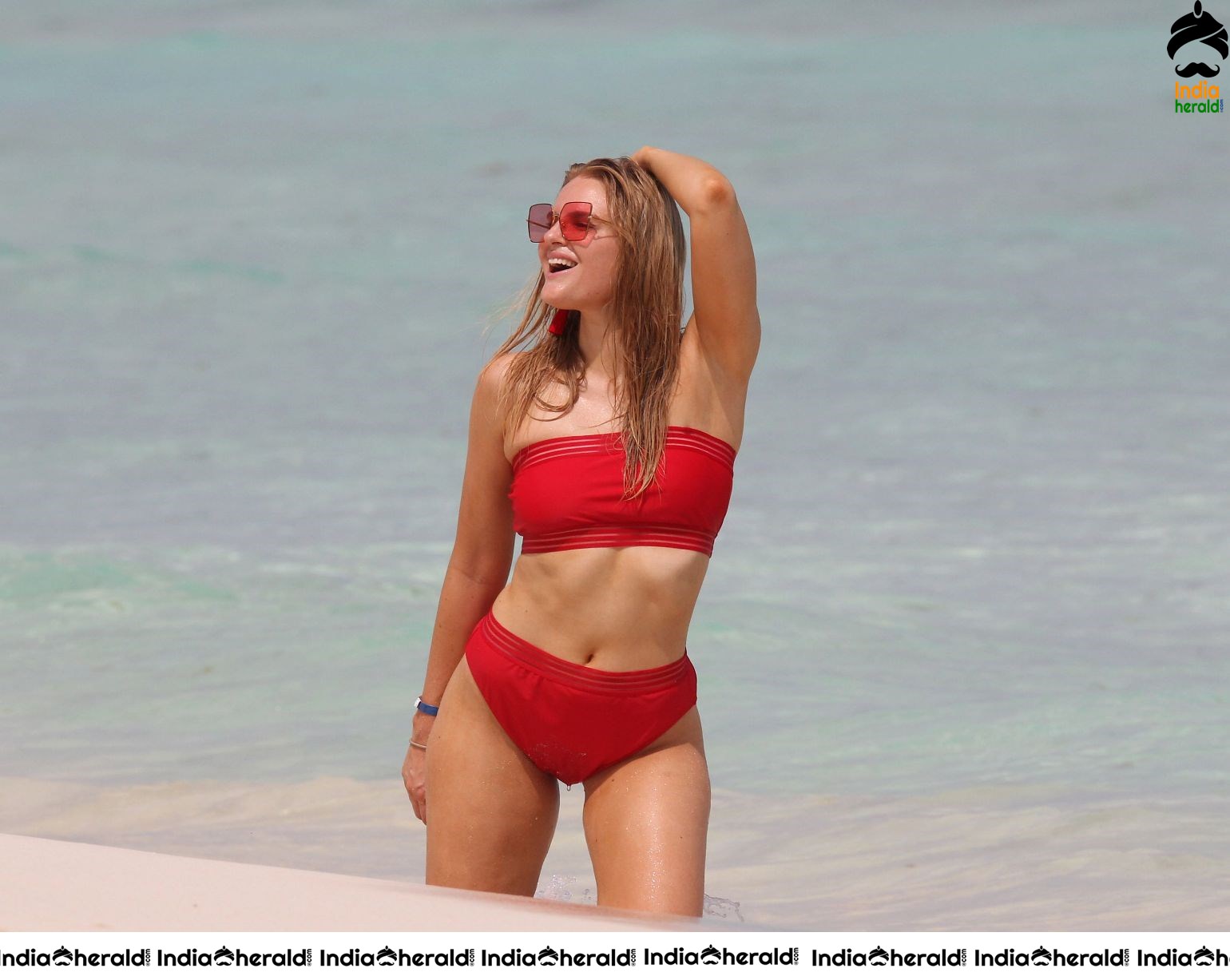 Grace Levy in a two piece red bikini while in Tulum Mexico