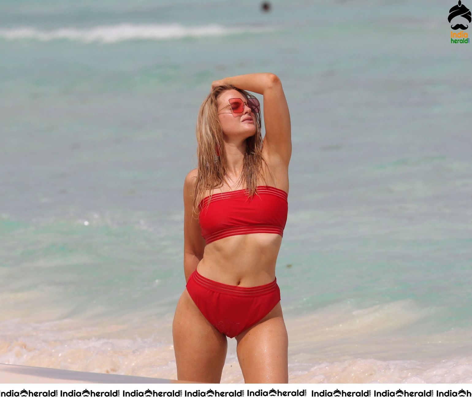 Grace Levy in a two piece red bikini while in Tulum Mexico