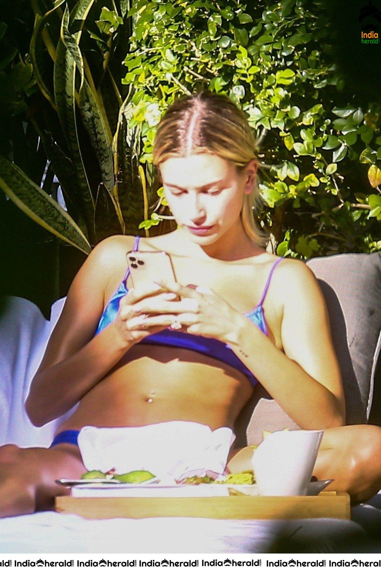 Hailey Bieber is enjoying some downtime by the pool in Miami