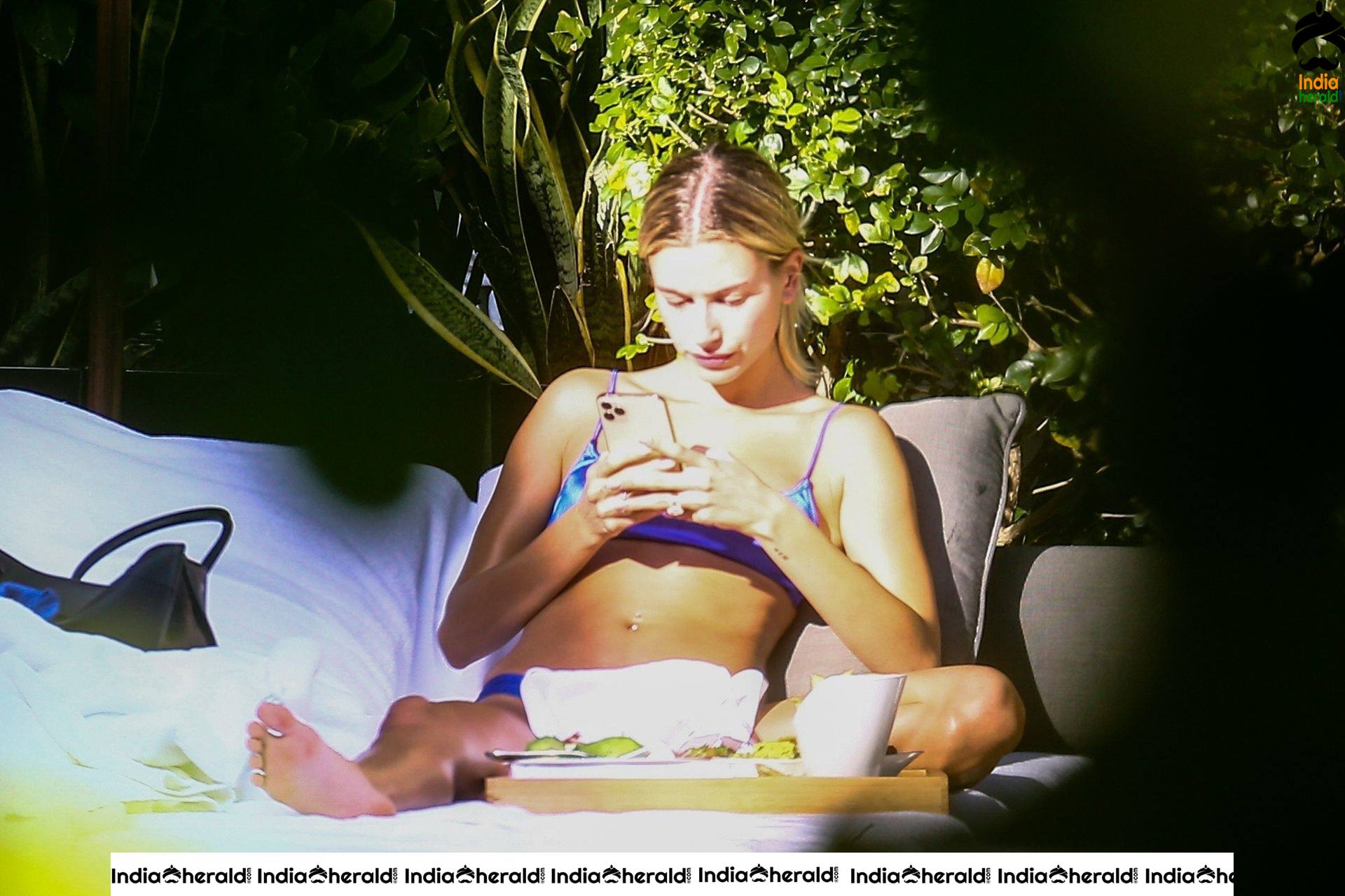 Hailey Bieber is enjoying some downtime by the pool in Miami
