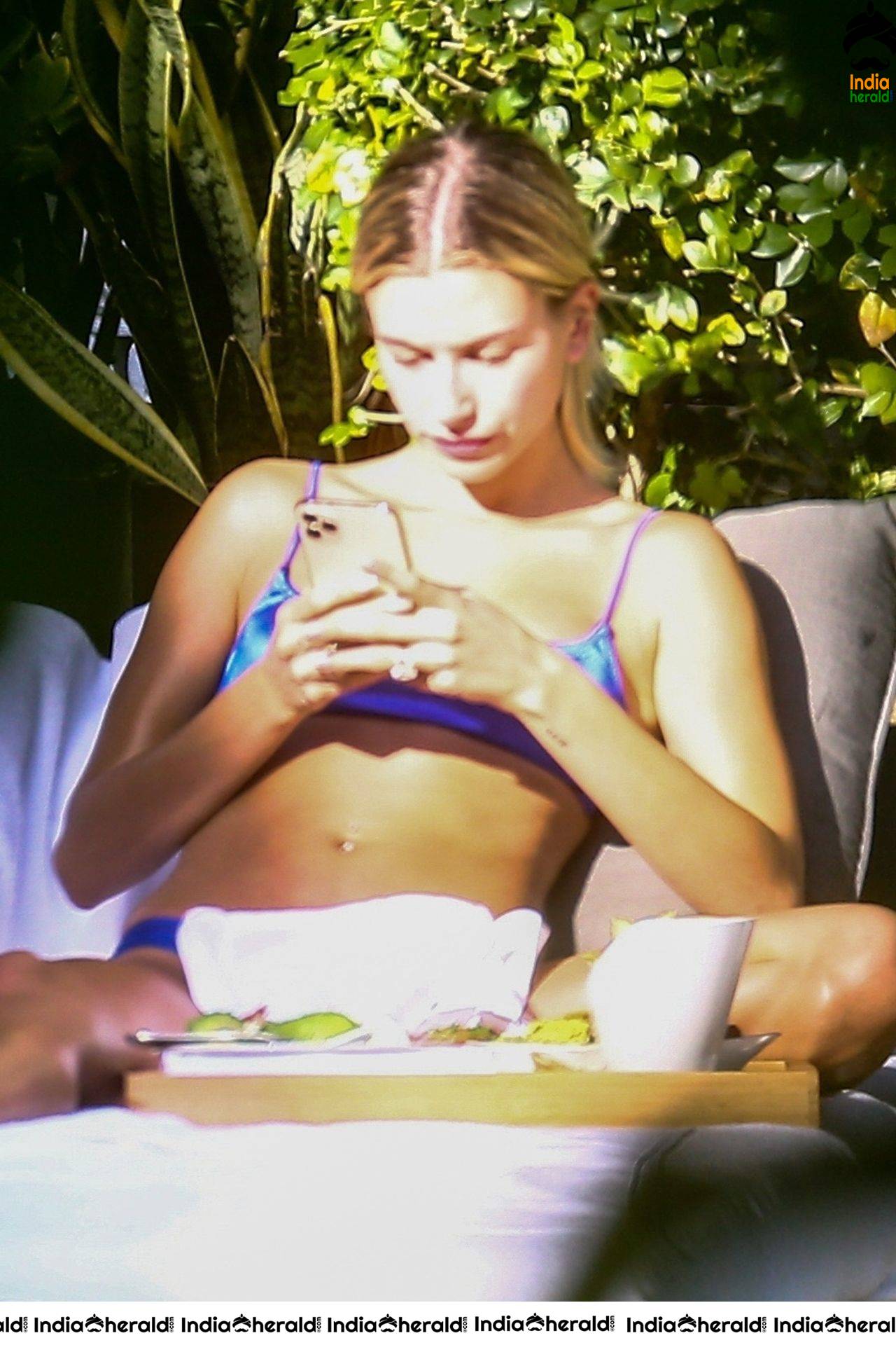 Hailey Bieber is enjoying some downtime by the pool in Miami