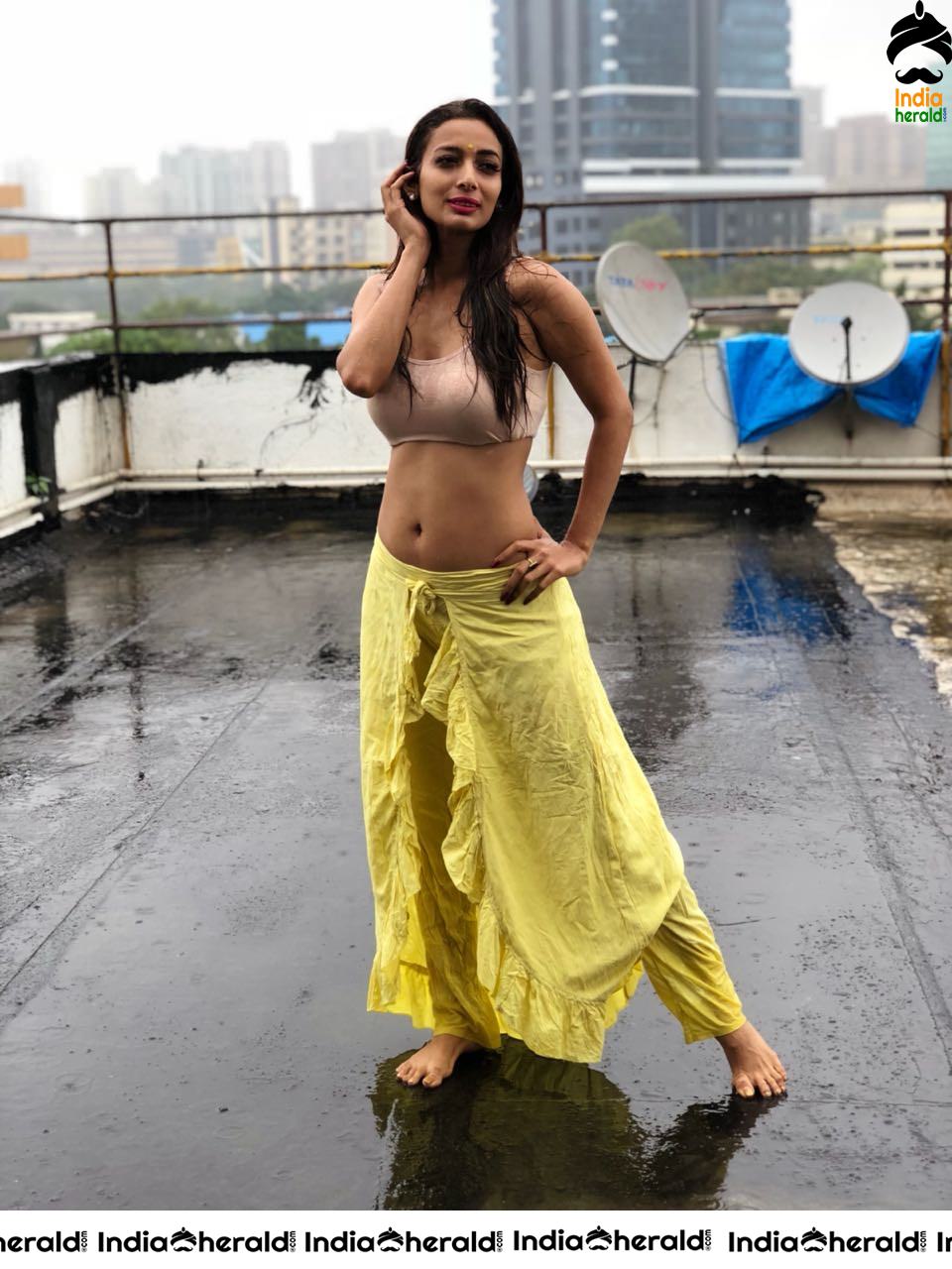 Heena Panchal Wearing a Sports Bra and Exposing her Hot Body on Roof Top while enjoying Rain