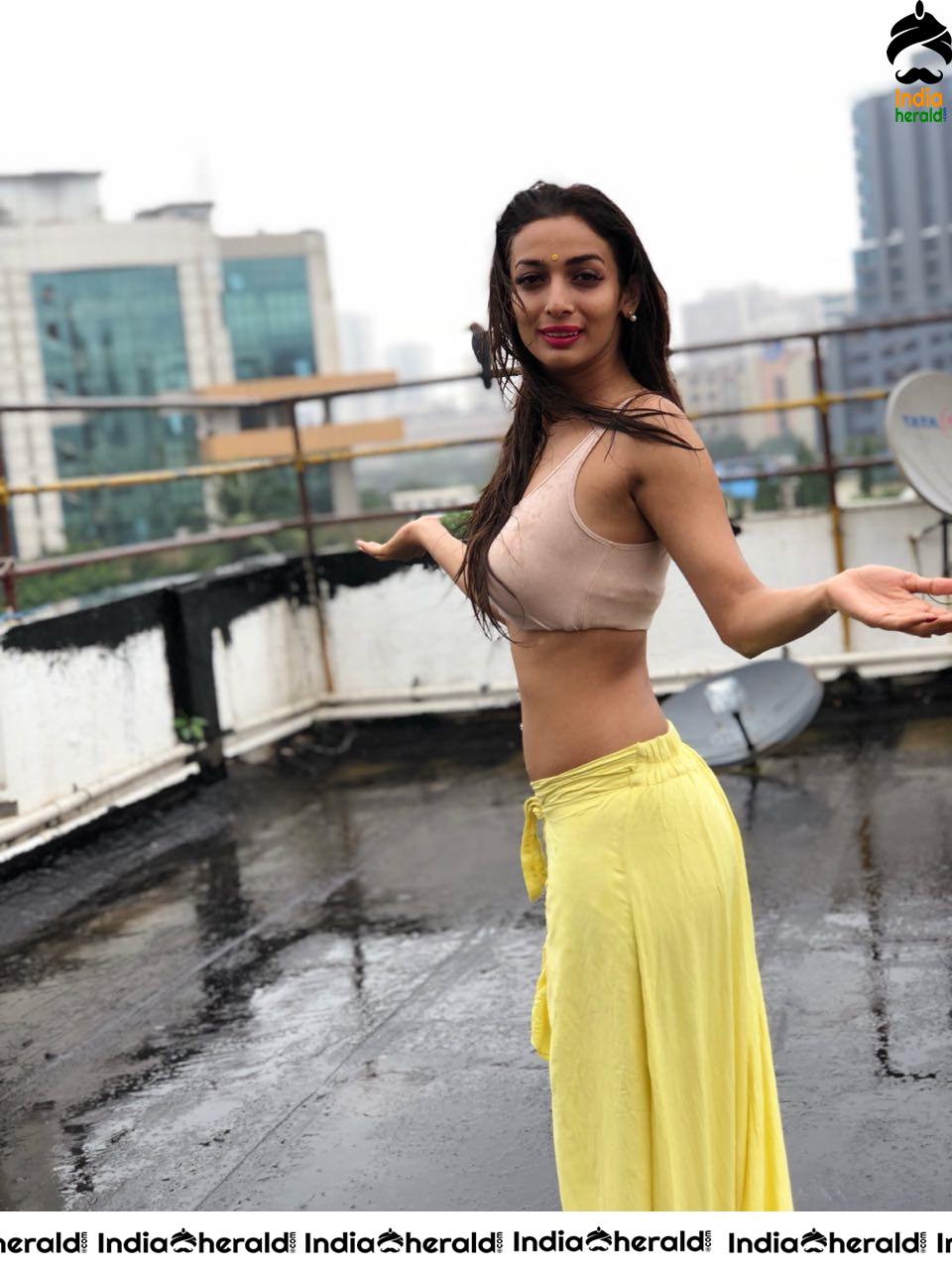 Heena Panchal Wearing a Sports Bra and Exposing her Hot Body on Roof Top while enjoying Rain