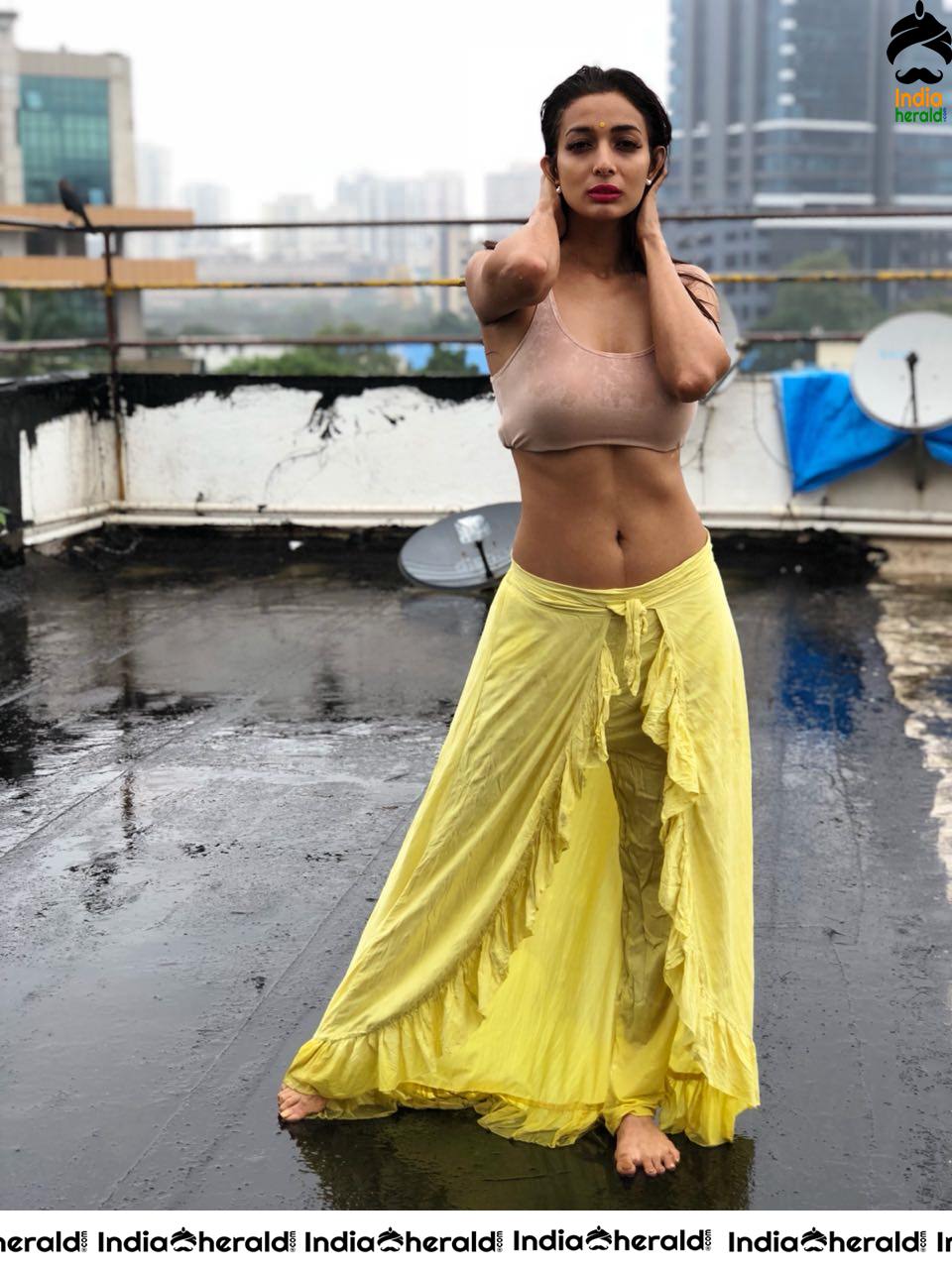 Heena Panchal Wearing a Sports Bra and Exposing her Hot Body on Roof Top while enjoying Rain