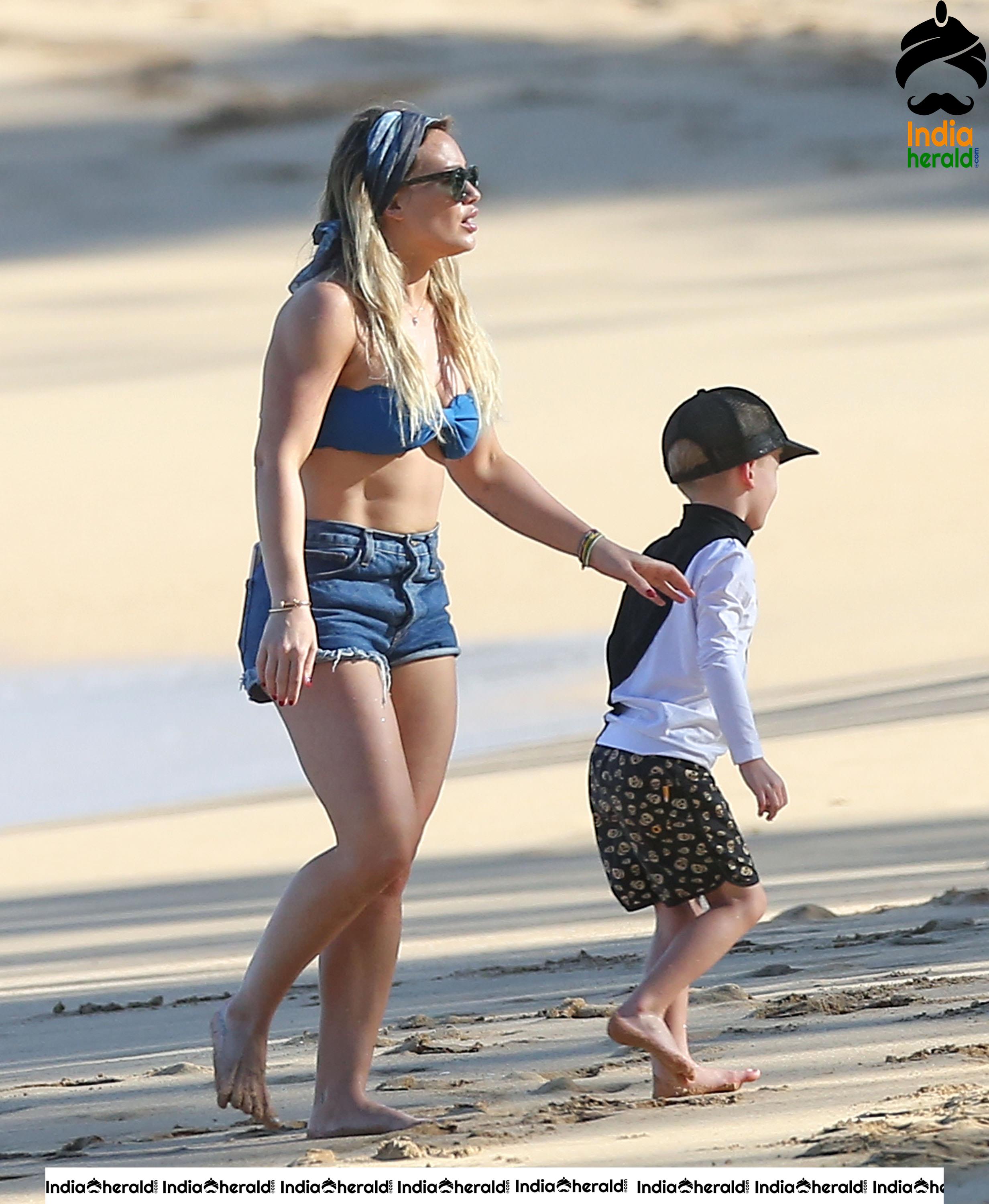 Hilary Duff Wearing a bikini top and shorts at the beach in Hawaii Set 2
