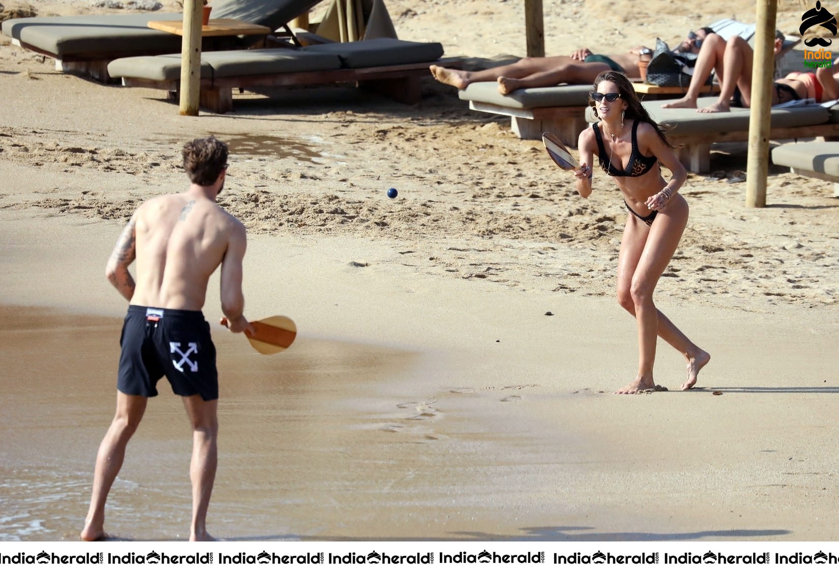 Izabel Goulart in Black String Bikini enjoying with Boyfriend on the beach in Mykonos Set 1