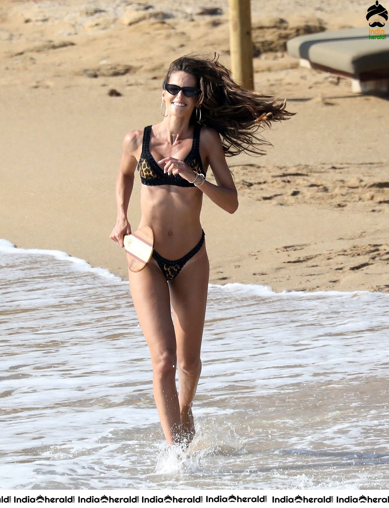 Izabel Goulart in Black String Bikini enjoying with Boyfriend on the beach in Mykonos Set 1