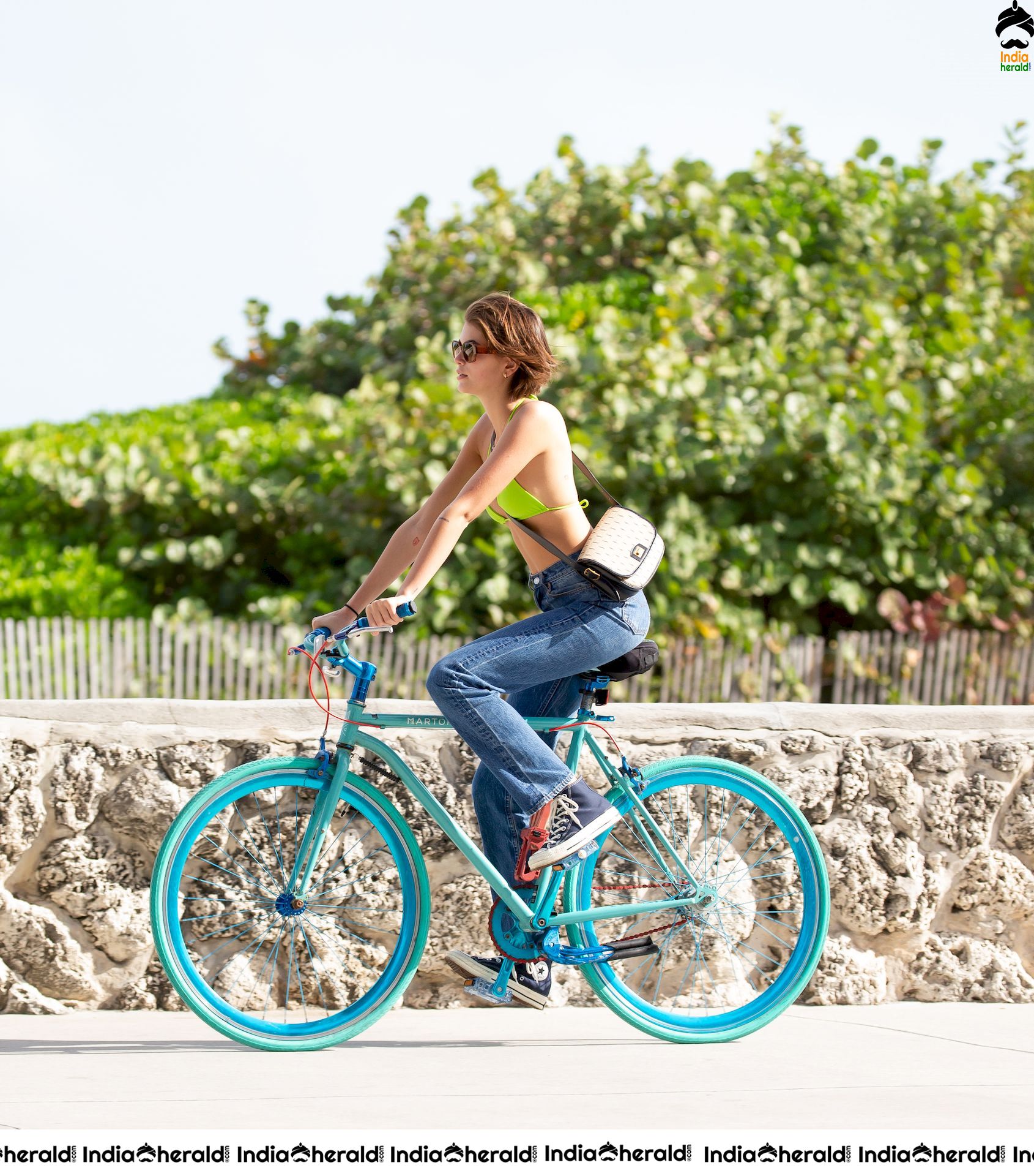 Kaia Gerber Cycling in a Bikini Top and Kissing her Boyfriend