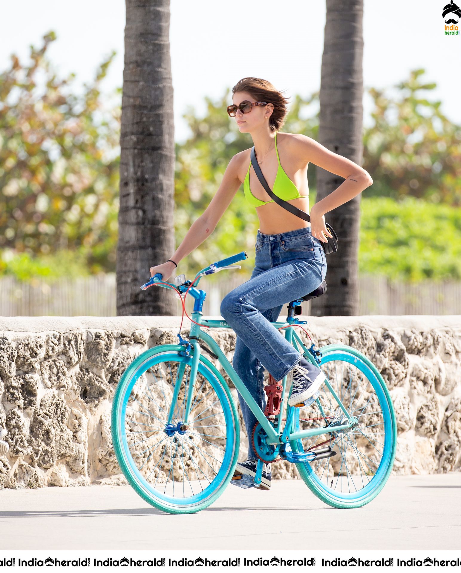 Kaia Gerber Cycling in a Bikini Top and Kissing her Boyfriend