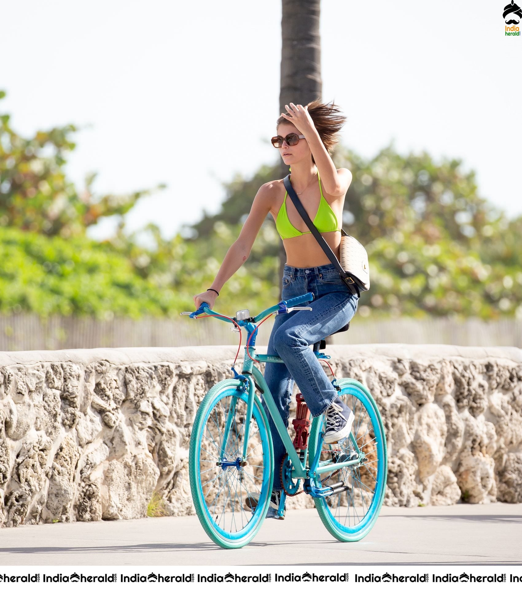 Kaia Gerber Cycling in a Bikini Top and Kissing her Boyfriend