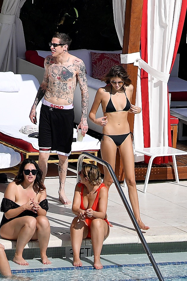 Kaia Gerber in a Black Lace Bikini by Poolside and Enjoys with Boyfriend Set 1