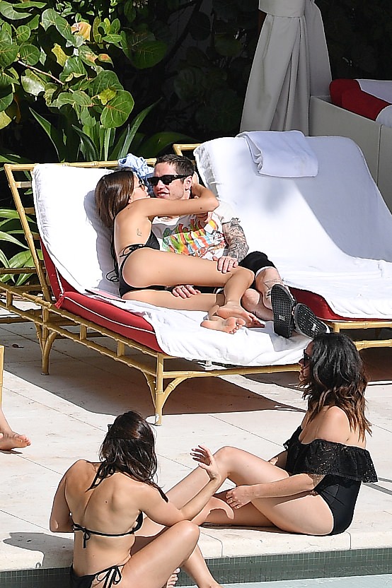 Kaia Gerber in a Black Lace Bikini by Poolside and Enjoys with Boyfriend Set 1