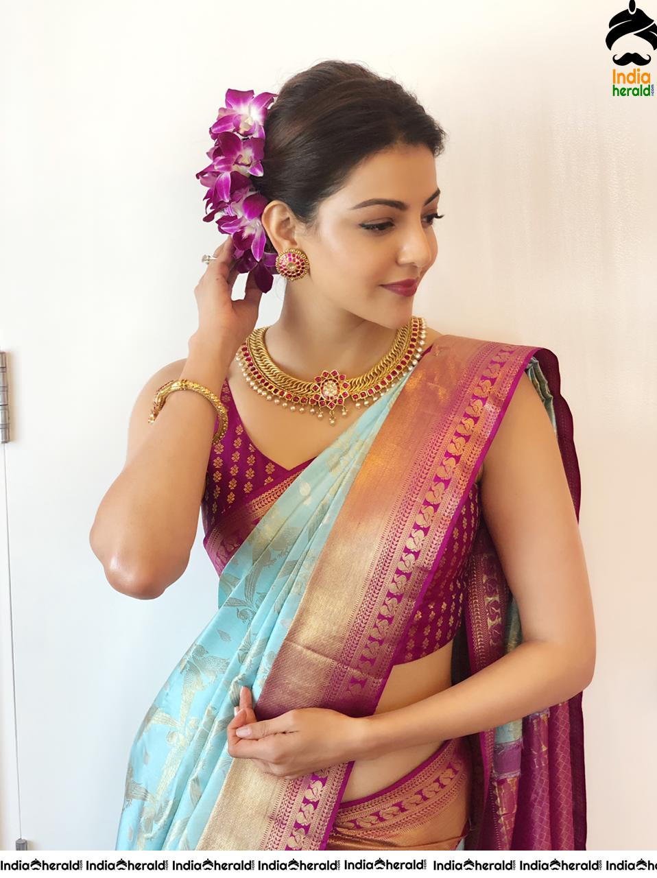 Kajal Aggarwal Showing her Sexy Hot Hip in Sleeveless Blouse and Saree