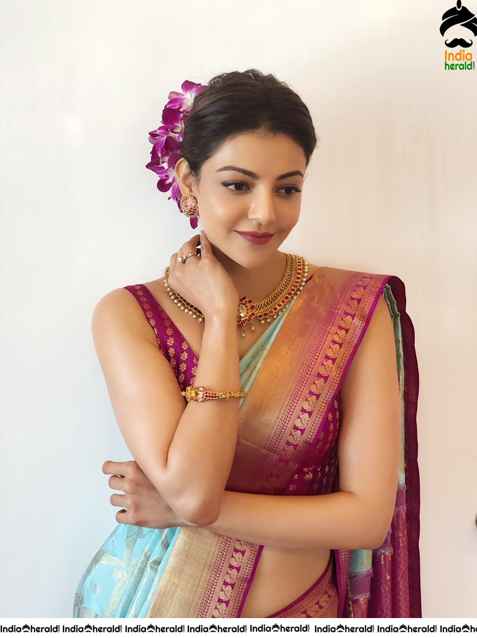Kajal Aggarwal Showing her Sexy Hot Hip in Sleeveless Blouse and Saree