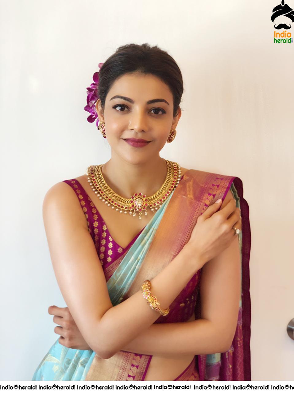 Kajal Aggarwal Showing her Sexy Hot Hip in Sleeveless Blouse and Saree