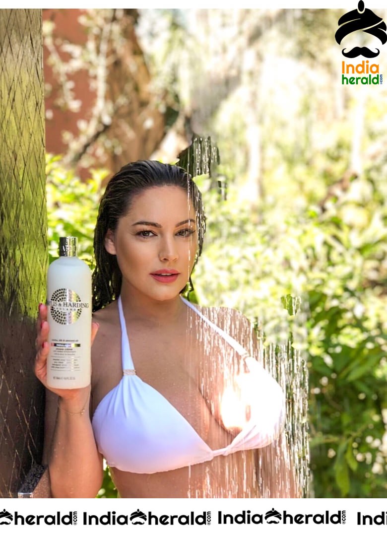Kelly Brook Showering in a White Bikini