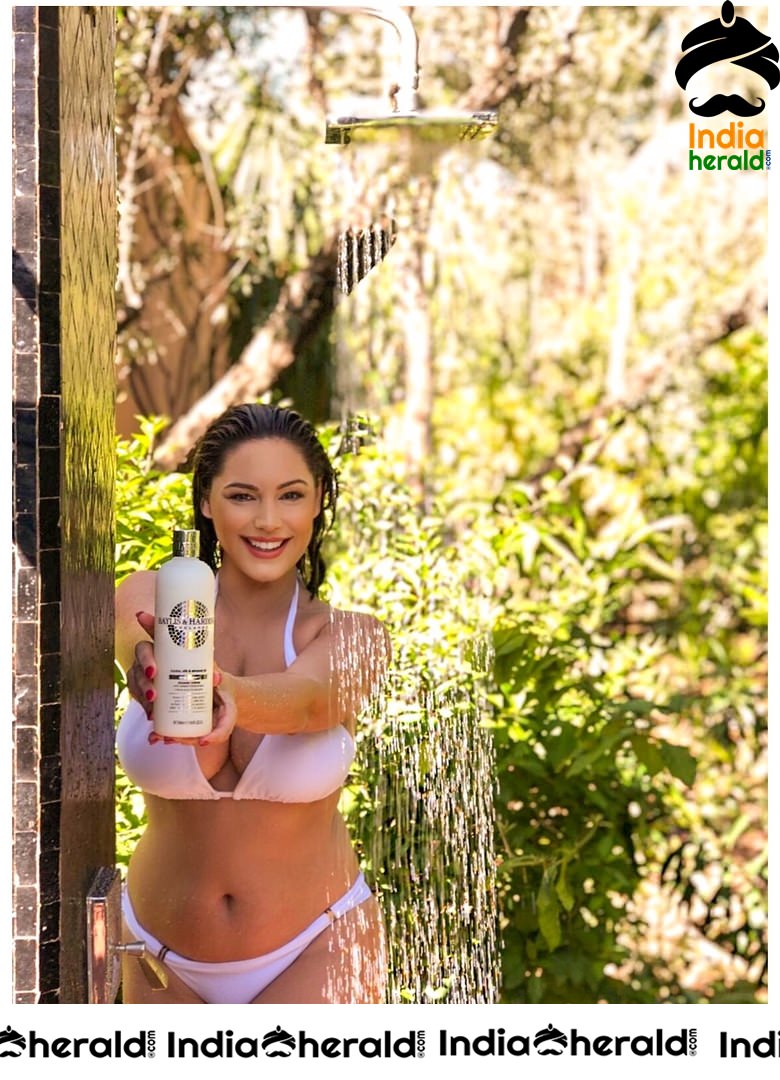 Kelly Brook Showering in a White Bikini