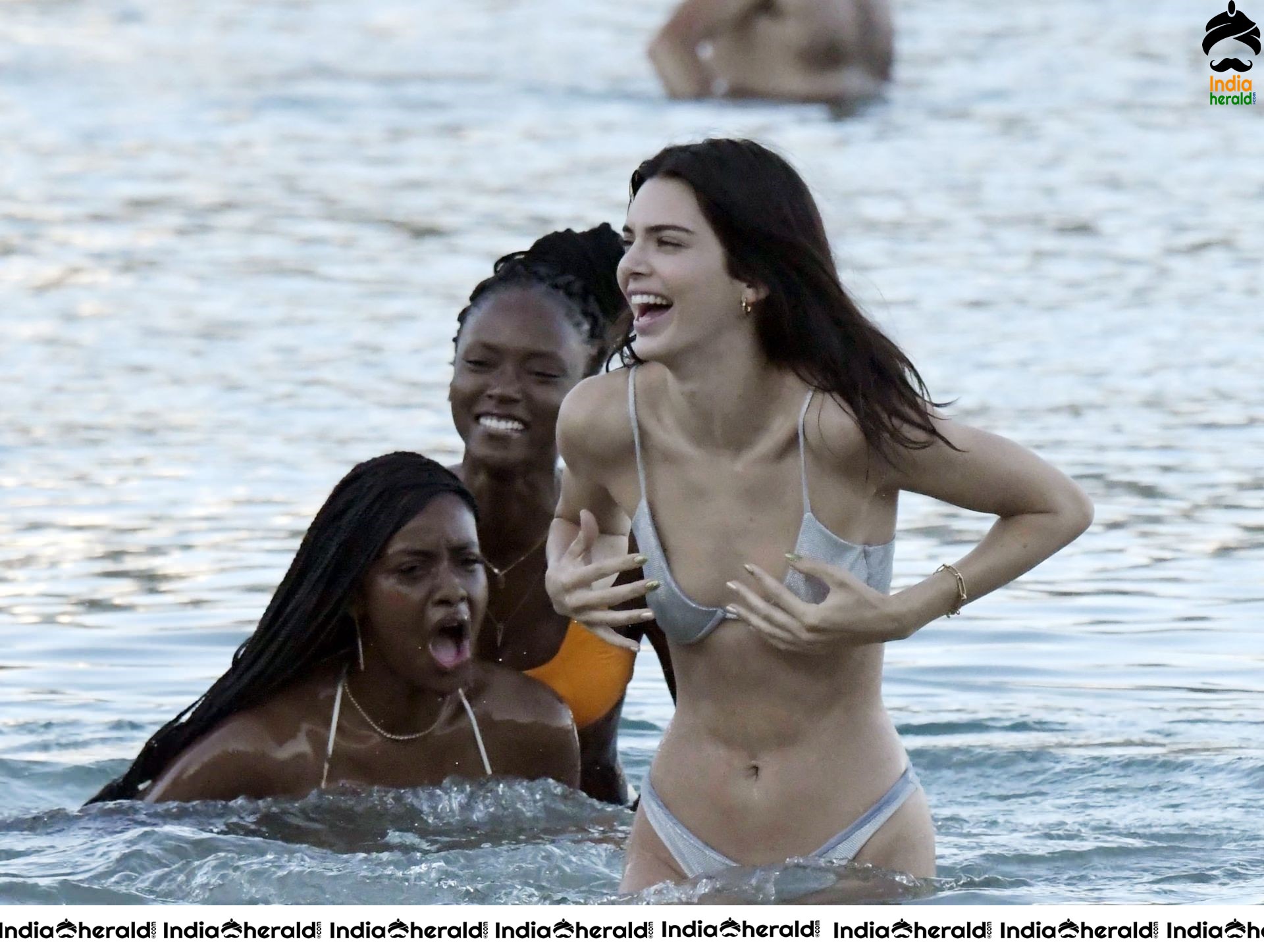 Kendall Jenner in a Bikini and flaunts her slim body and peeping assets at a Beach in Mykonos