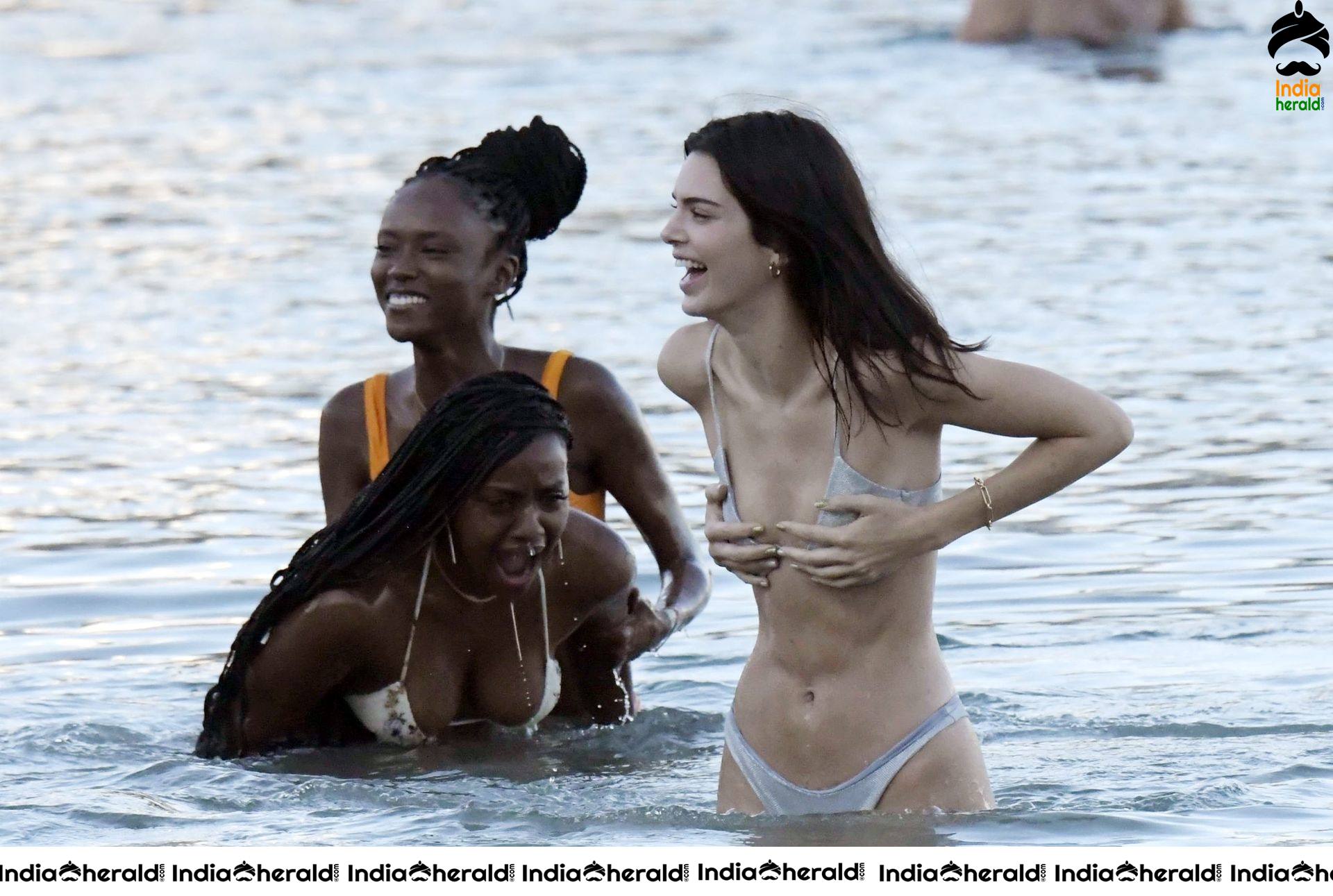 Kendall Jenner in a Bikini and flaunts her slim body and peeping assets at a Beach in Mykonos