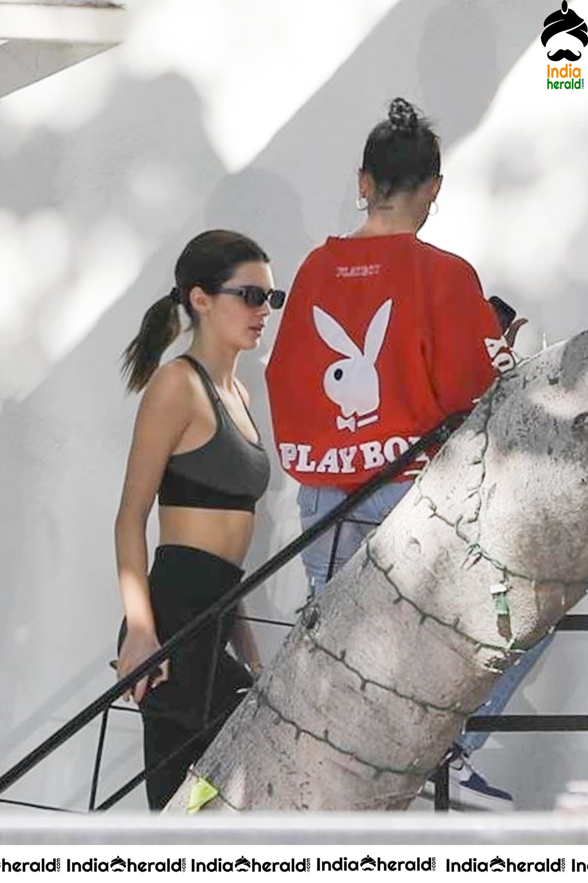 Kendall Jenner in Sports Bra while caught by Paparazzi outside her hair colorist office in LA