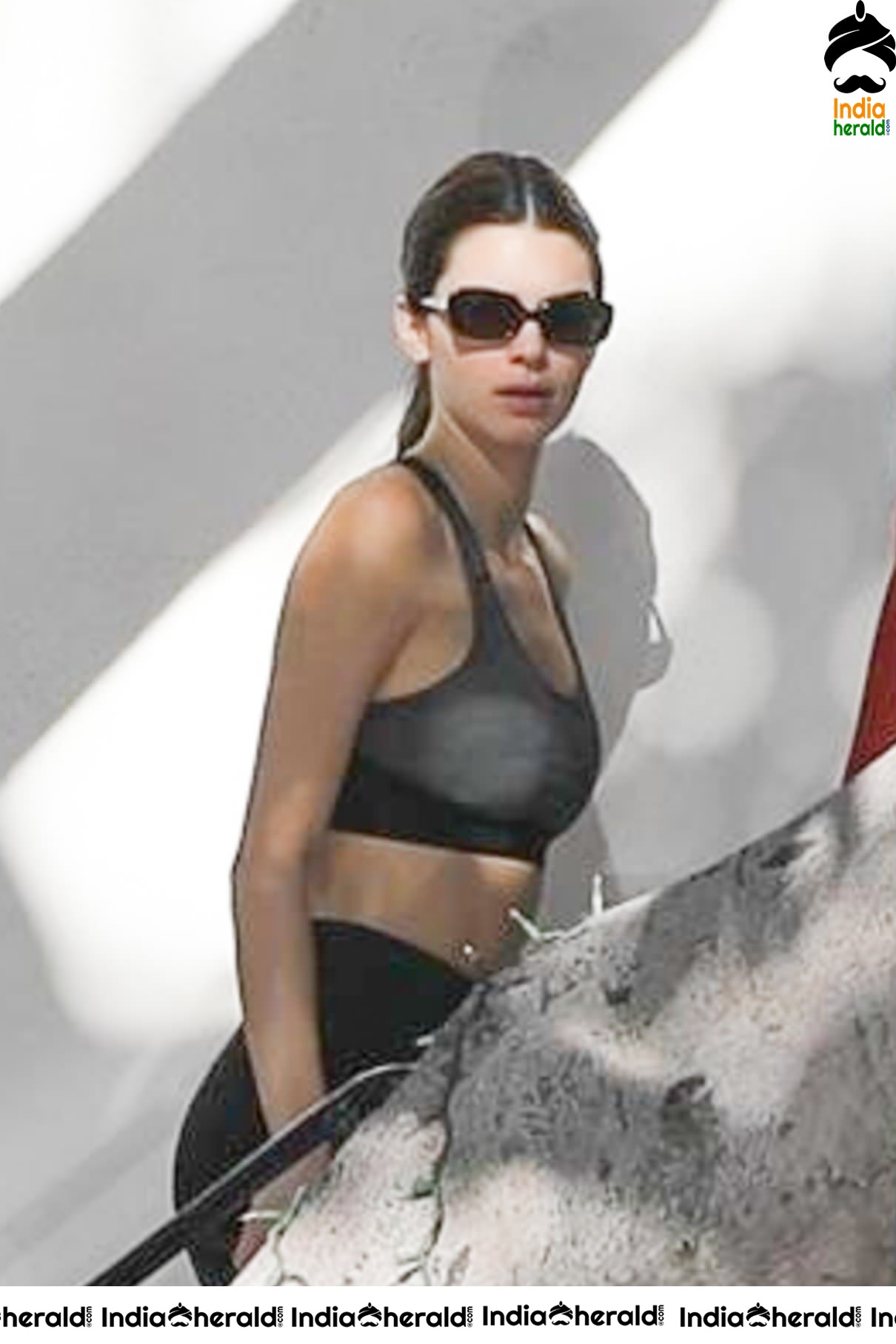 Kendall Jenner in Sports Bra while caught by Paparazzi outside her hair colorist office in LA