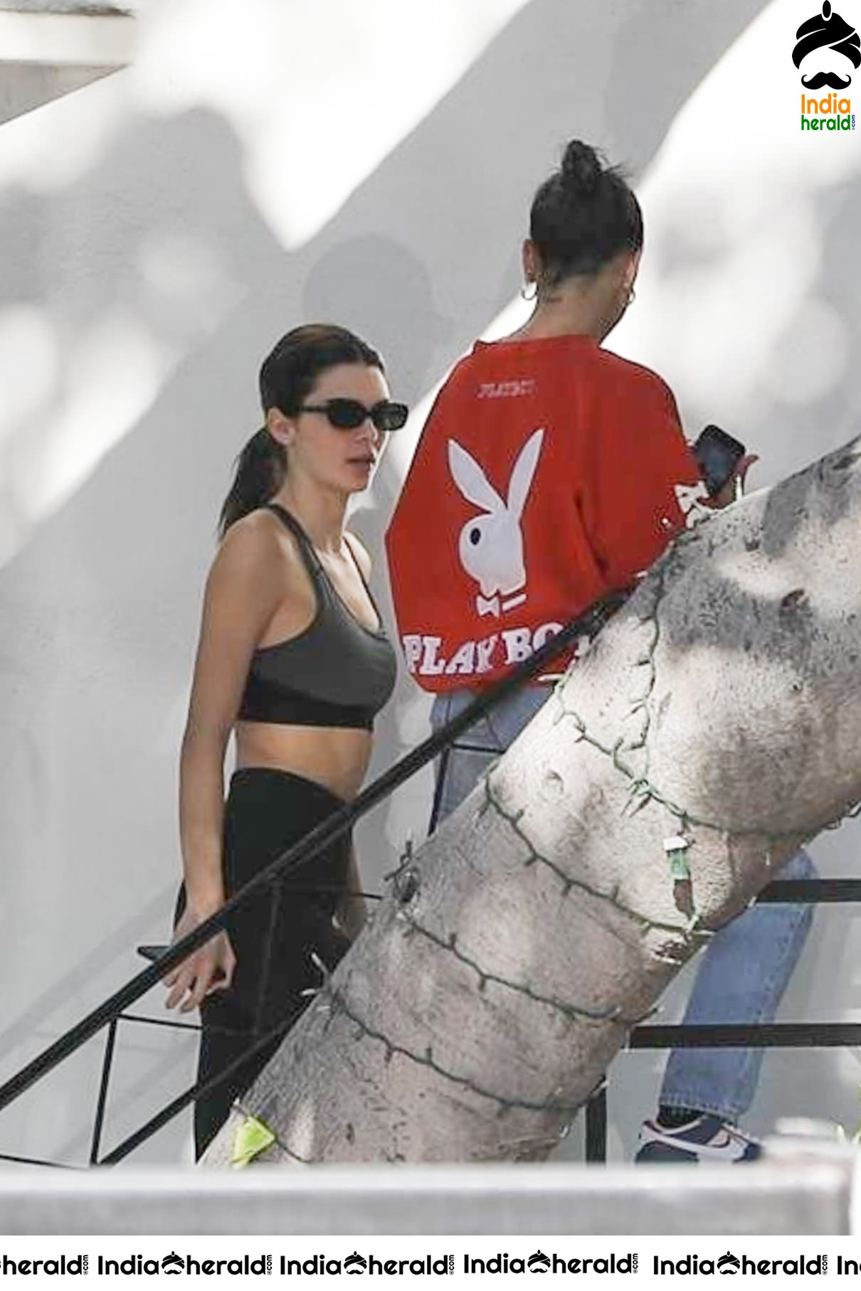 Kendall Jenner in Sports Bra while caught by Paparazzi outside her hair colorist office in LA