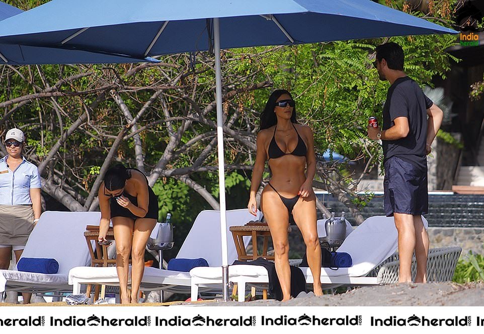 Kim Kardashian in Black Bikini Exposing on the beach in Costa Rica