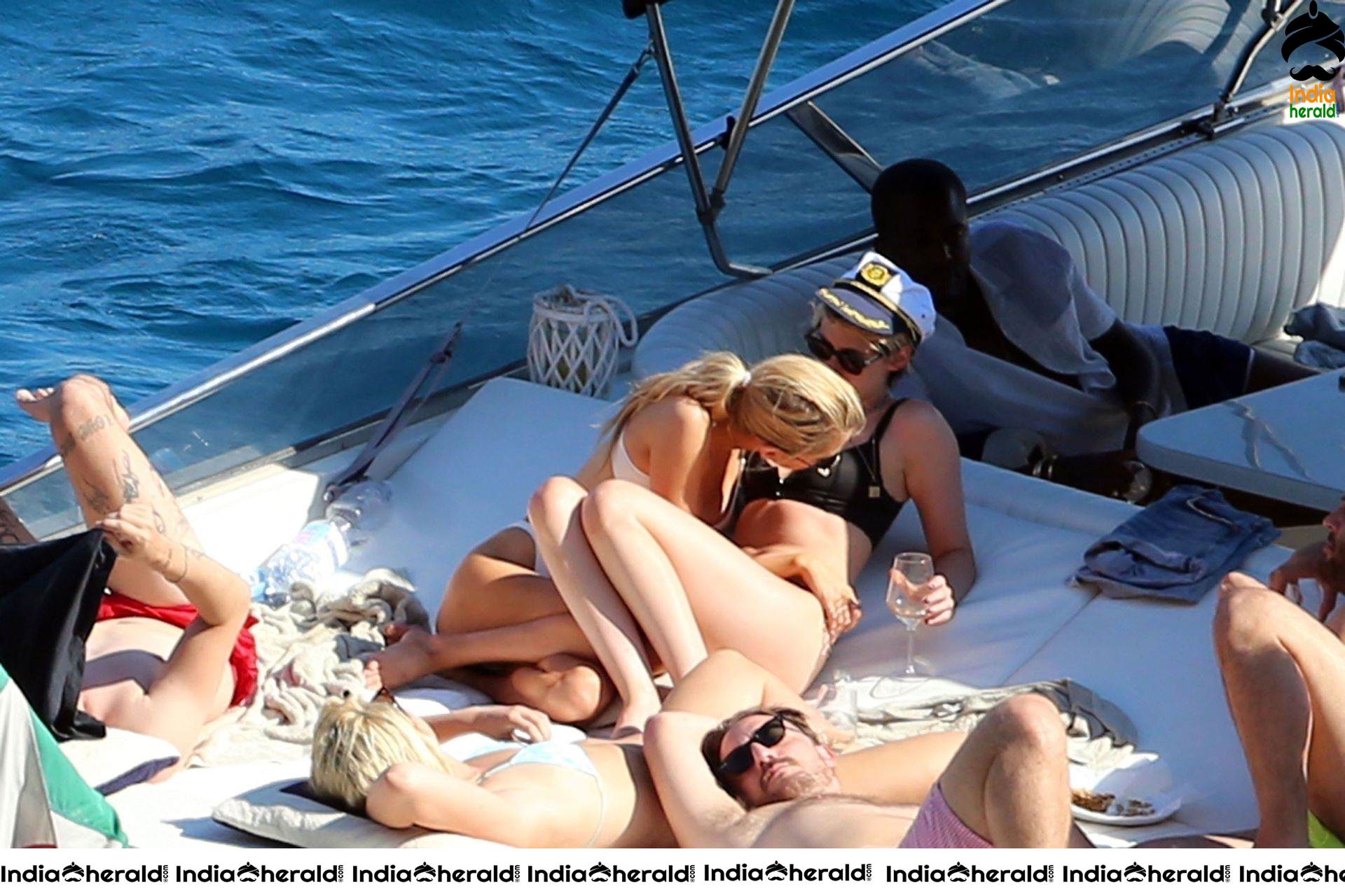 Kristen Stewart and Stella Maxwell Kissing and Cuddling each other in Bikinis at a Boat in Italy Set 1