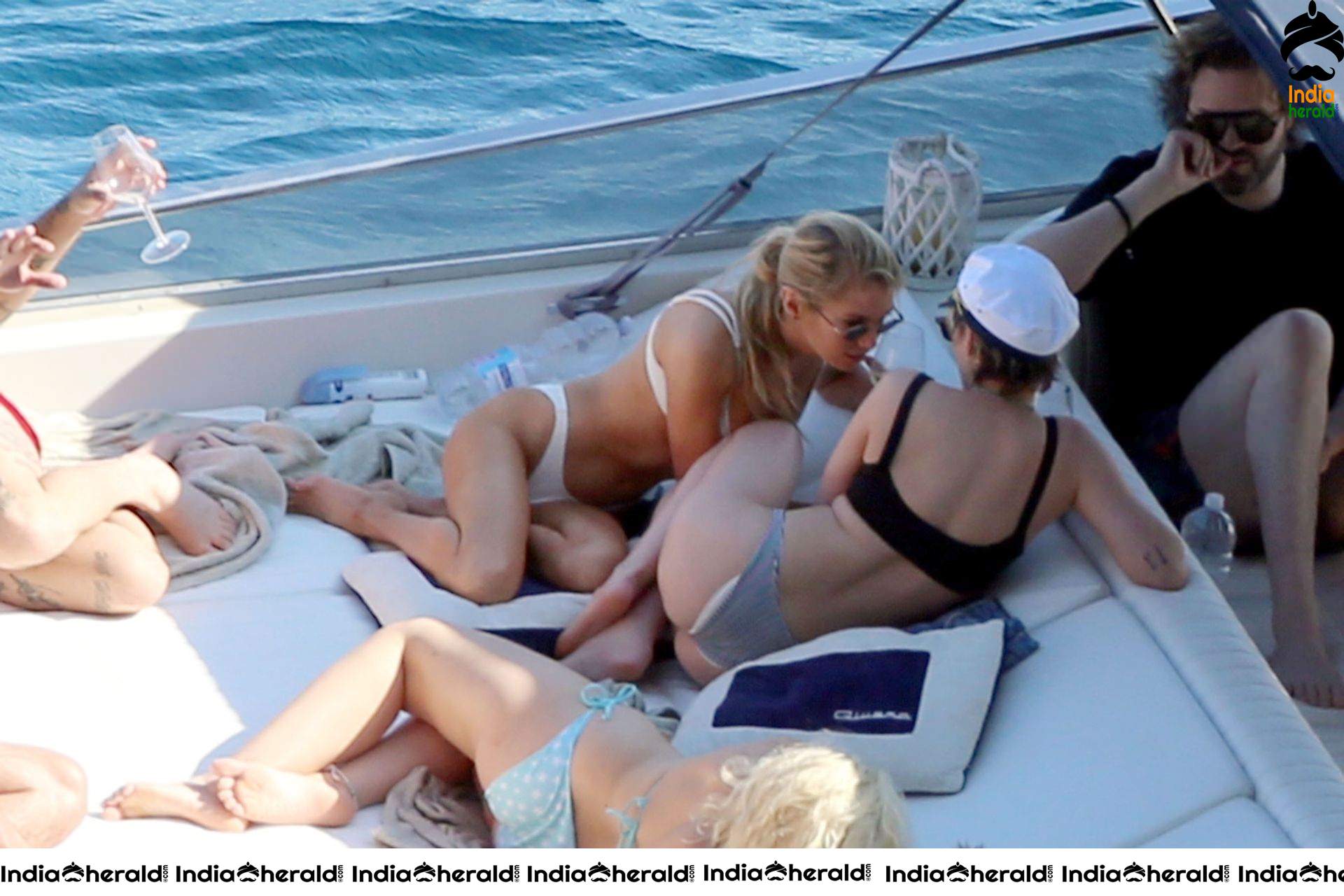 Kristen Stewart and Stella Maxwell Kissing and Cuddling each other in Bikinis at a Boat in Italy Set 1