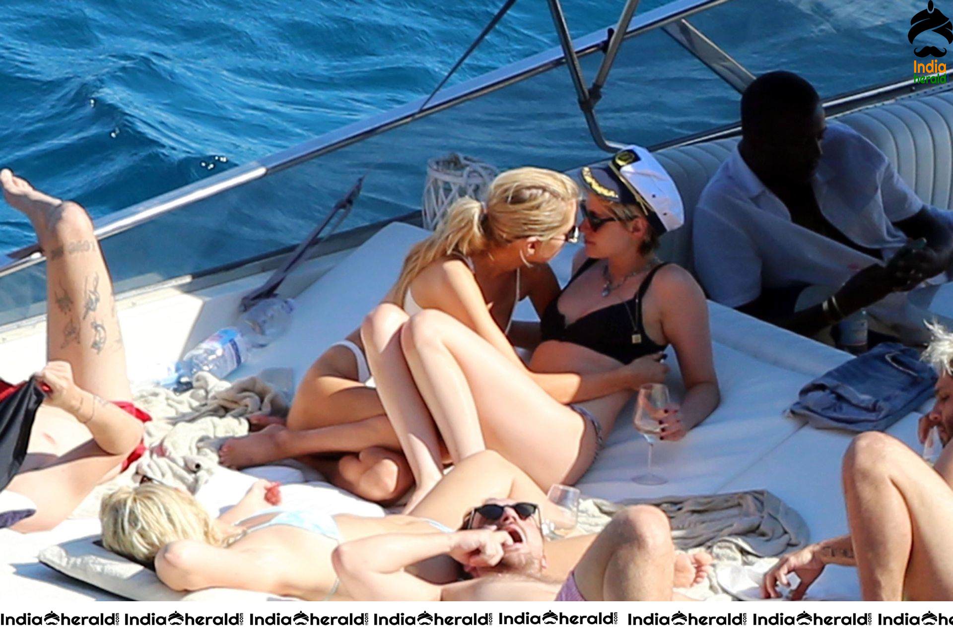 Kristen Stewart and Stella Maxwell Kissing and Cuddling each other in Bikinis at a Boat in Italy Set 1