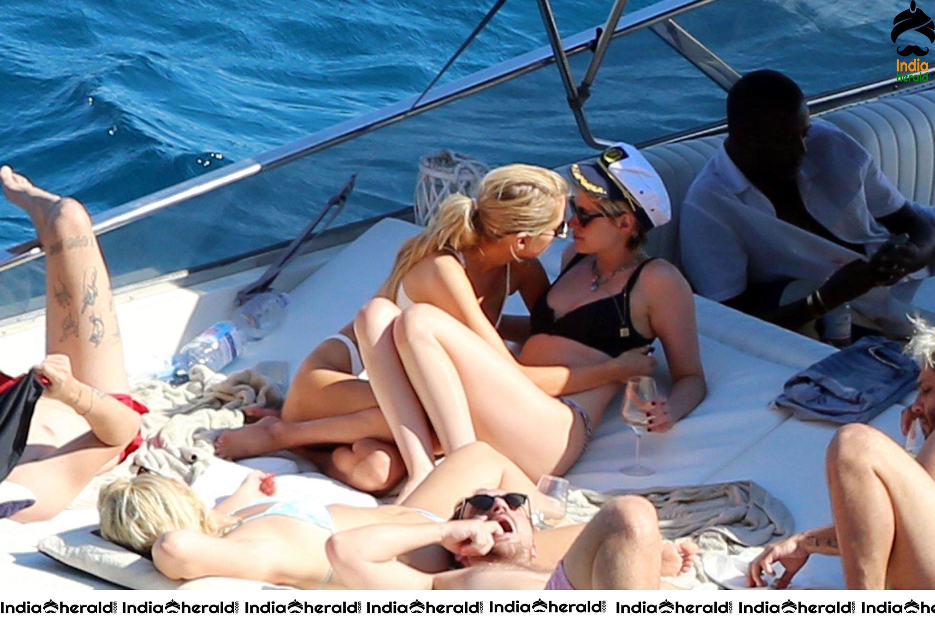 Kristen Stewart and Stella Maxwell Kissing and Cuddling each other in Bikinis at a Boat in Italy Set 1