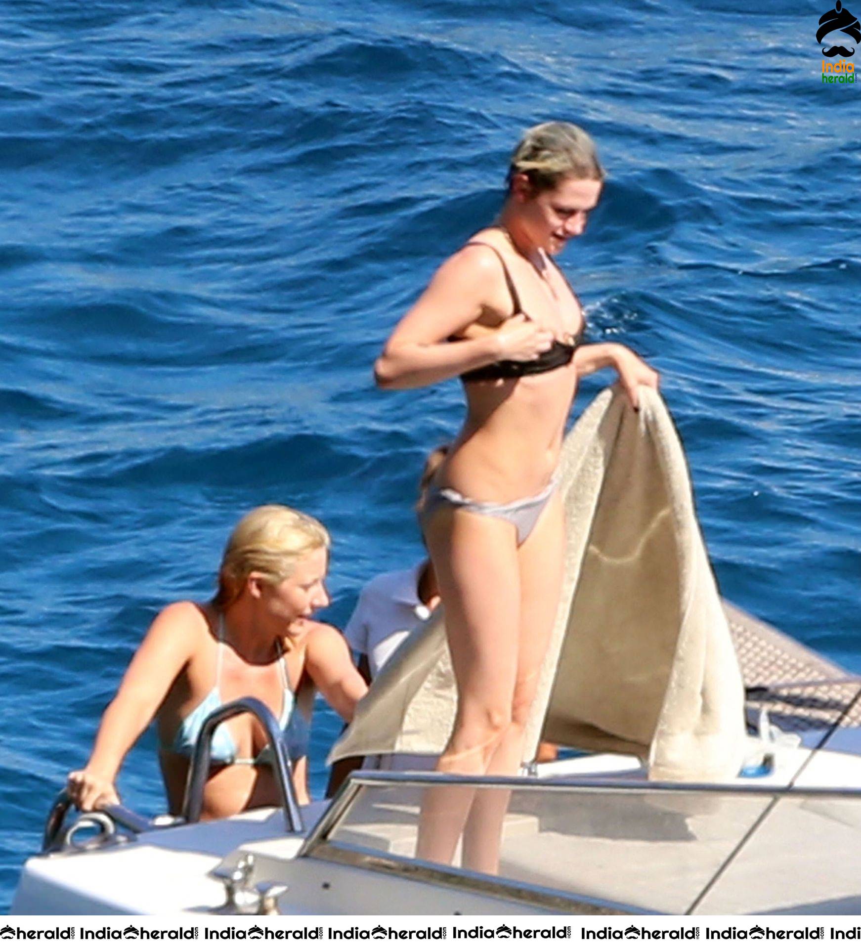 Kristen Stewart and Stella Maxwell Kissing and Cuddling each other in Bikinis at a Boat in Italy Set 1