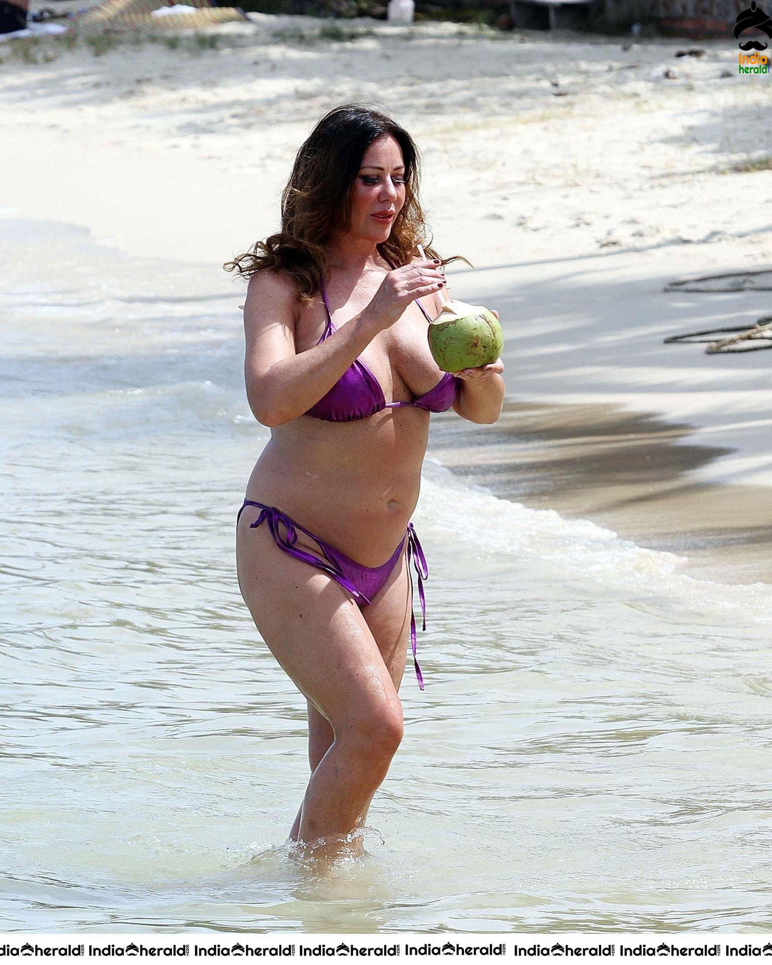 Lisa Appleton in a shiny purple bikini while on holiday in Thailand