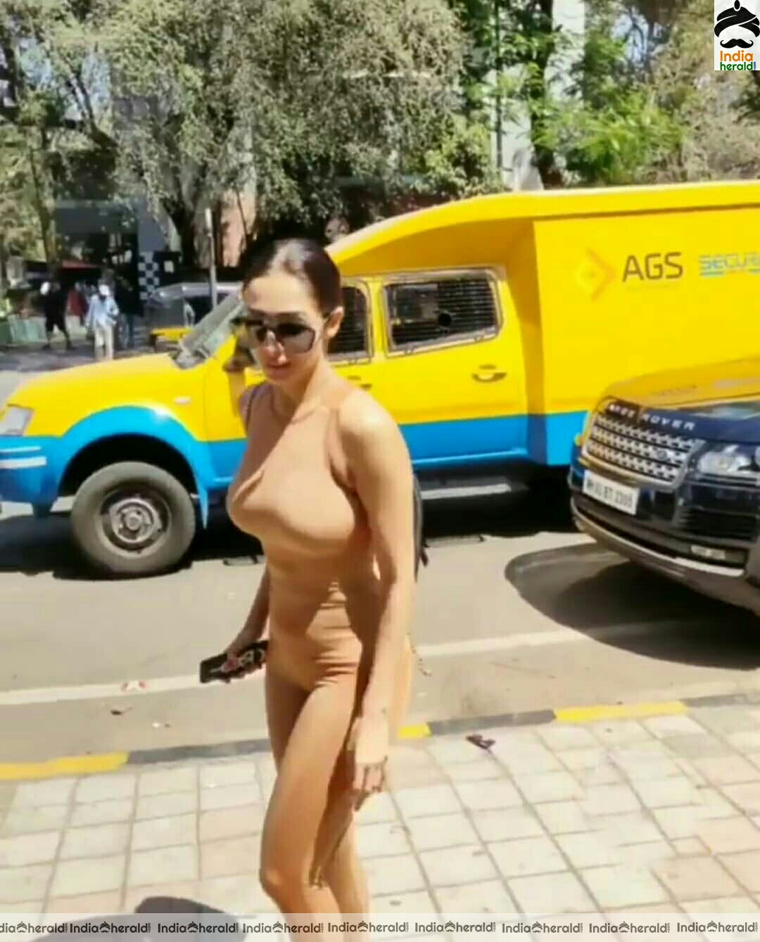 Malaika Arora slaying it Hot in Nude Gym dress photos