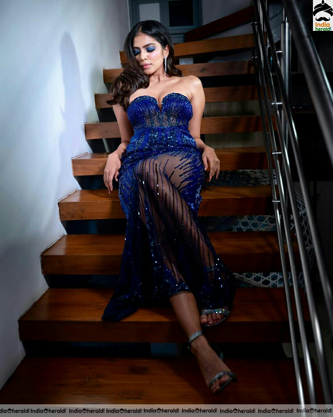 Malavika Mohanan Hot Cleavage Show In Blue Dress Stills