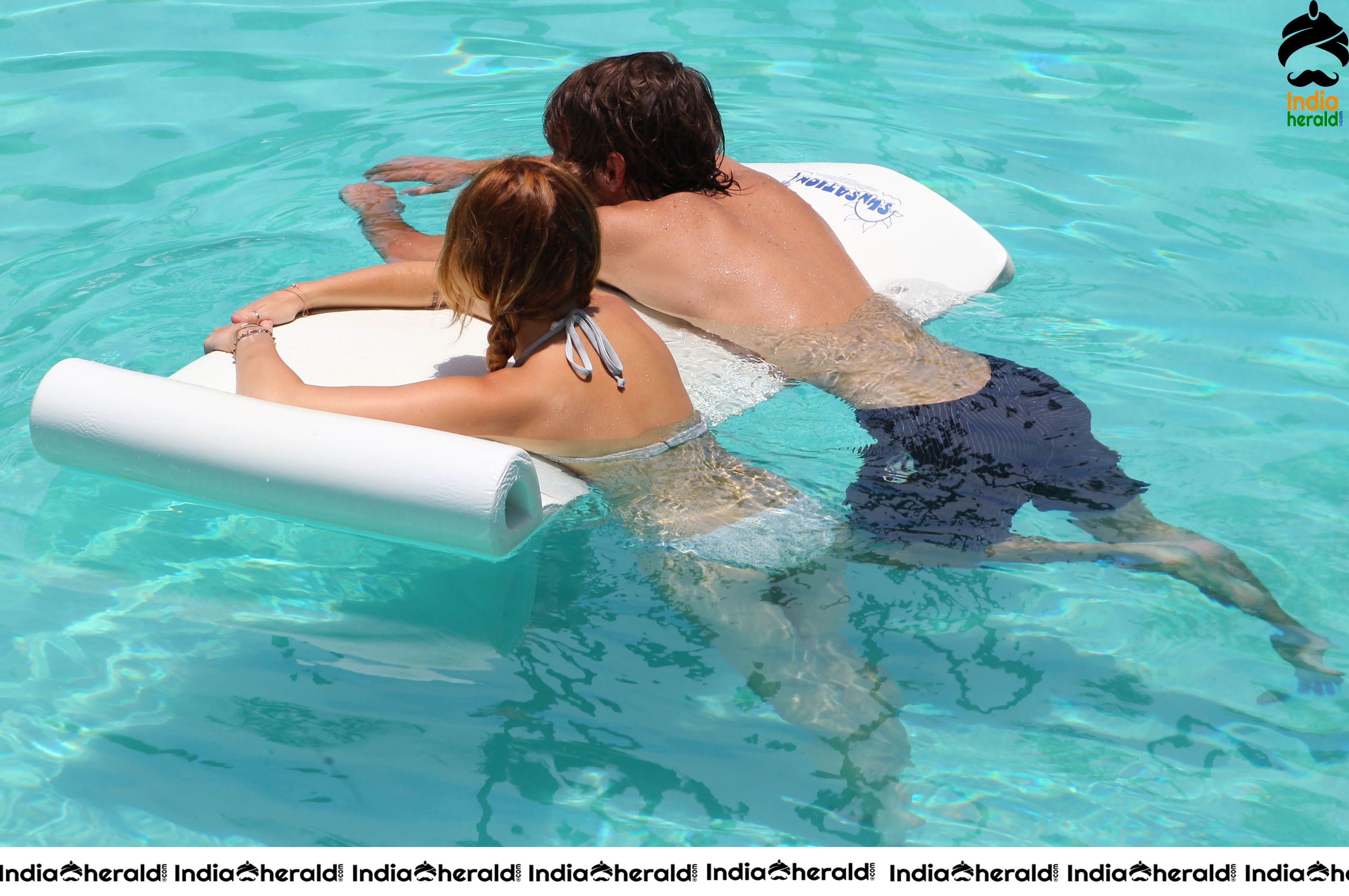 Miley Cyrus caught in Bikini while chilling by Pool Set 1