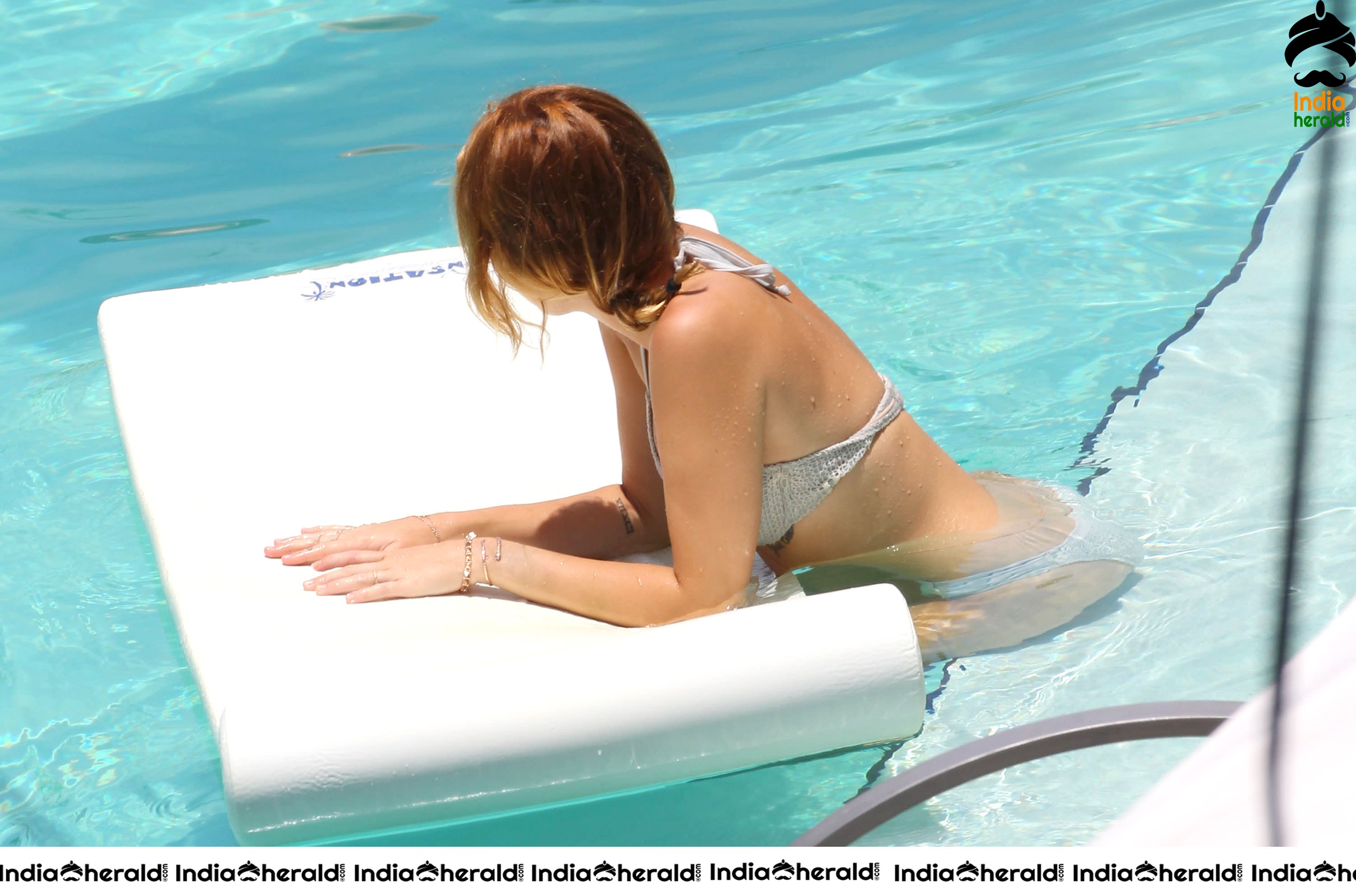 Miley Cyrus caught in Bikini while chilling by Pool Set 1