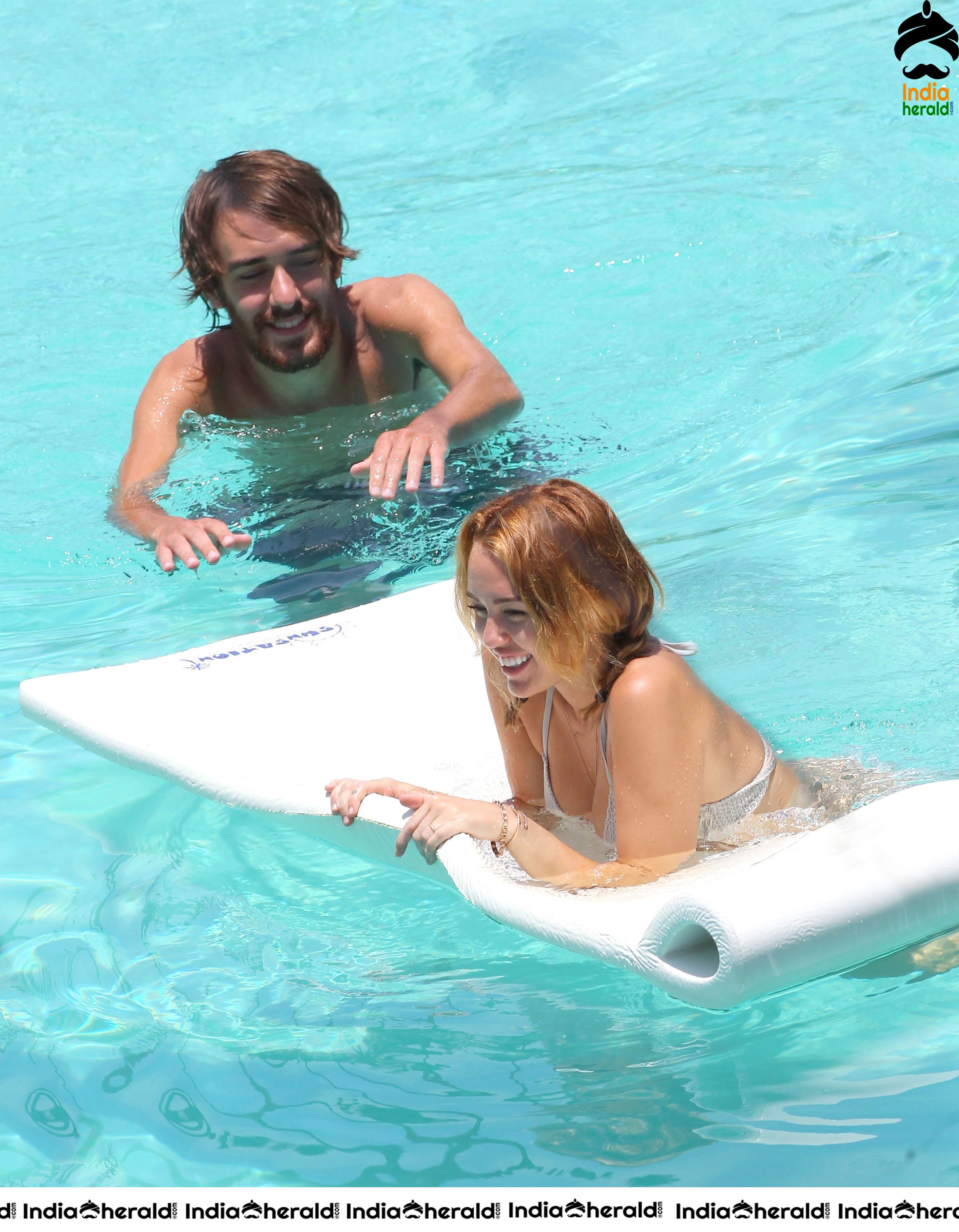 Miley Cyrus caught in Bikini while chilling by Pool Set 1
