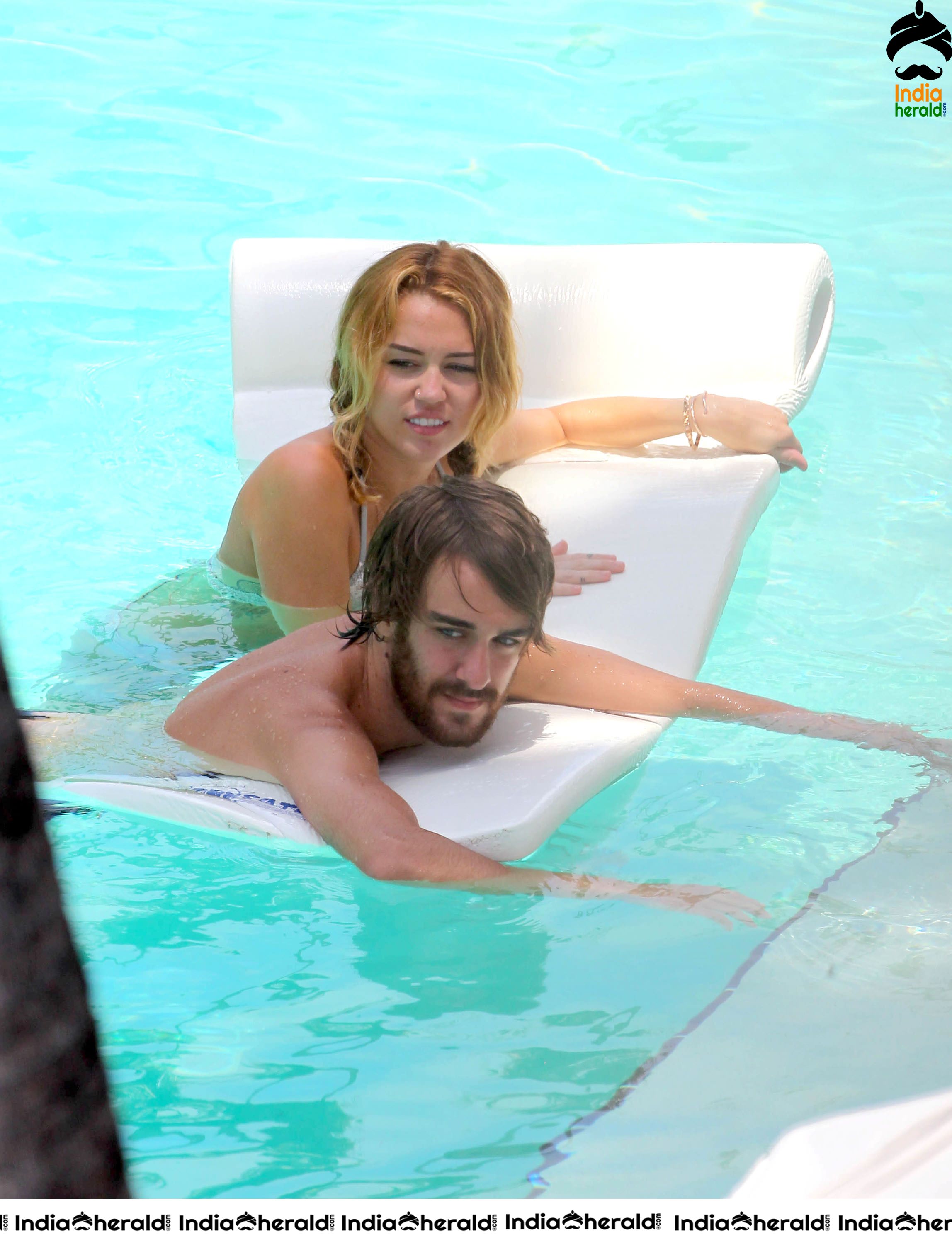 Miley Cyrus caught in Bikini while chilling by Pool Set 1
