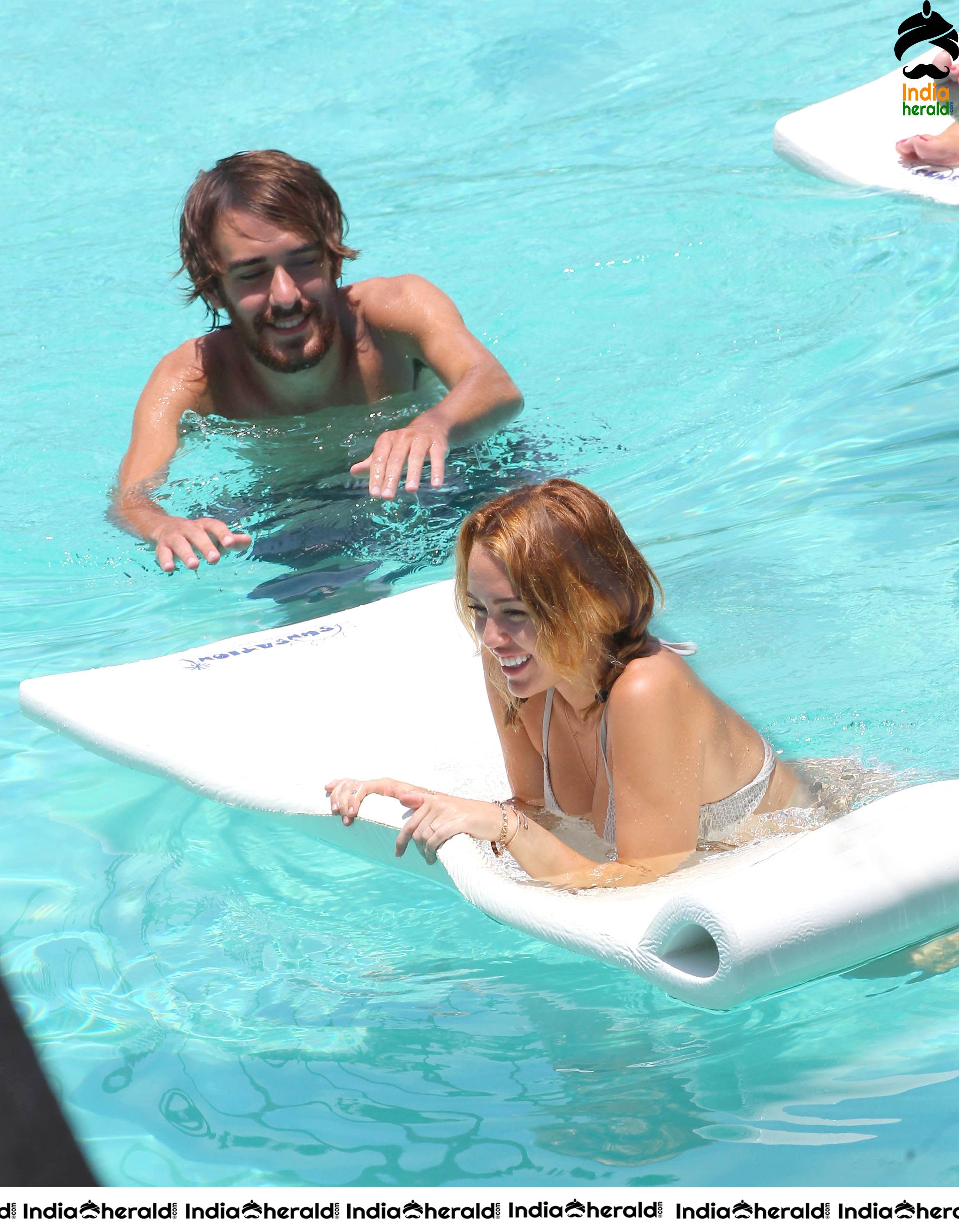 Miley Cyrus caught in Bikini while chilling by Pool Set 1